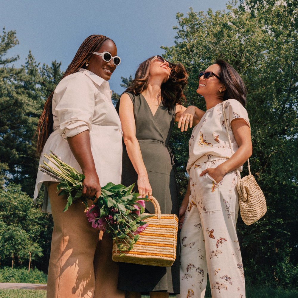 Three women standing outdoors one of them wearing The Madelyn Pull-On Pant - Airy Cotton :: Butterfly Print