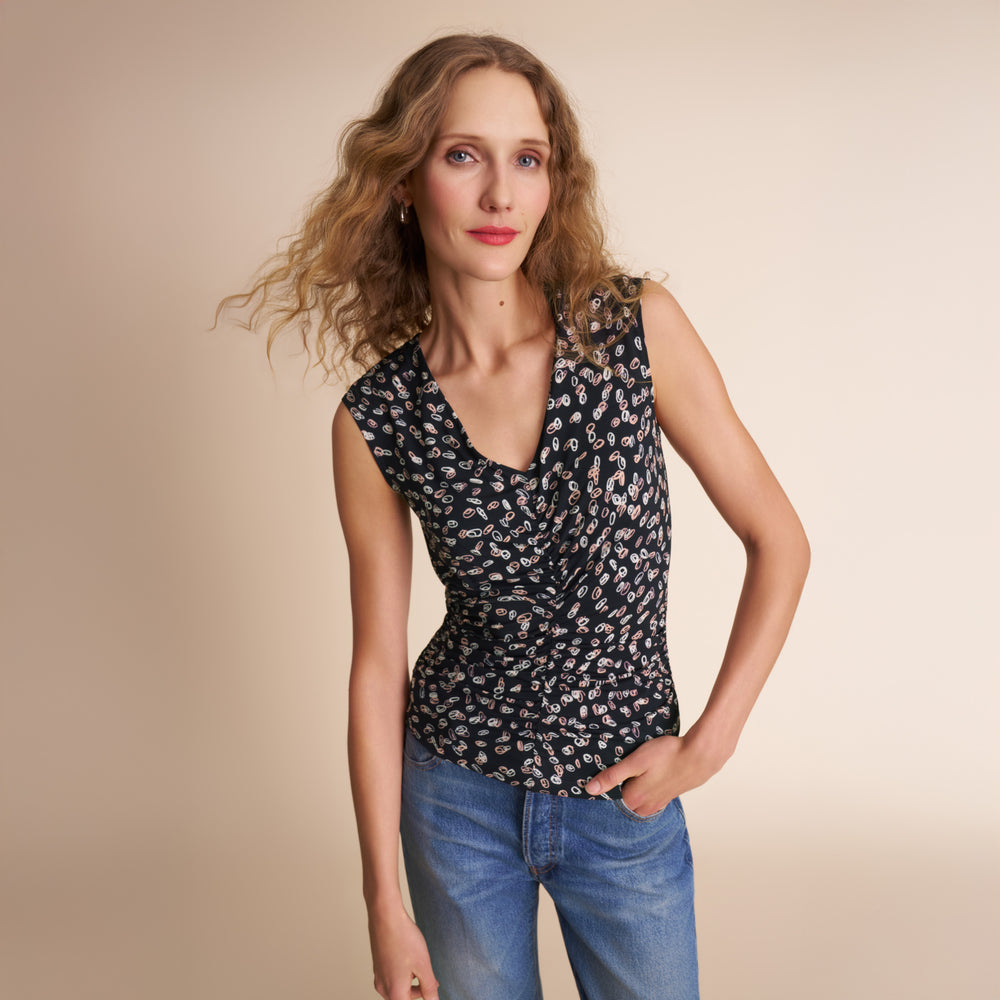 image of a woman wearing the franka top in spin dot