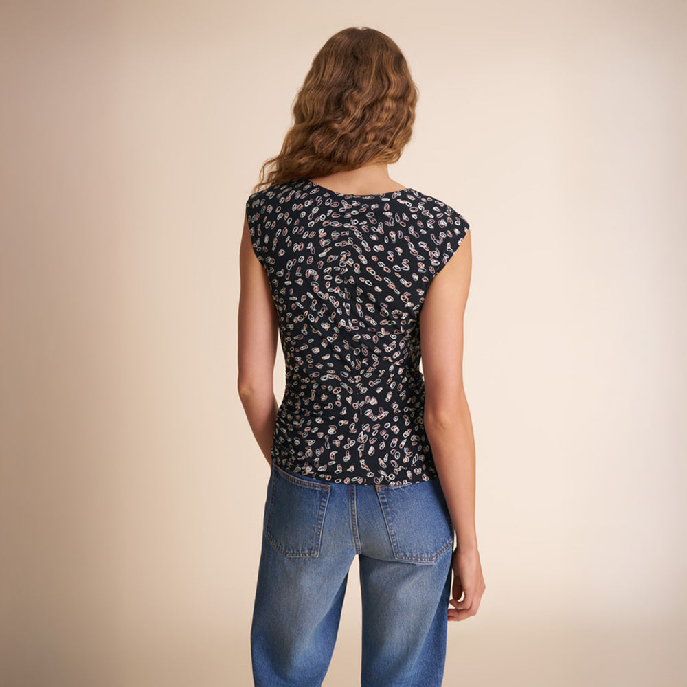 image of a woman wearing the franka top in spin dot