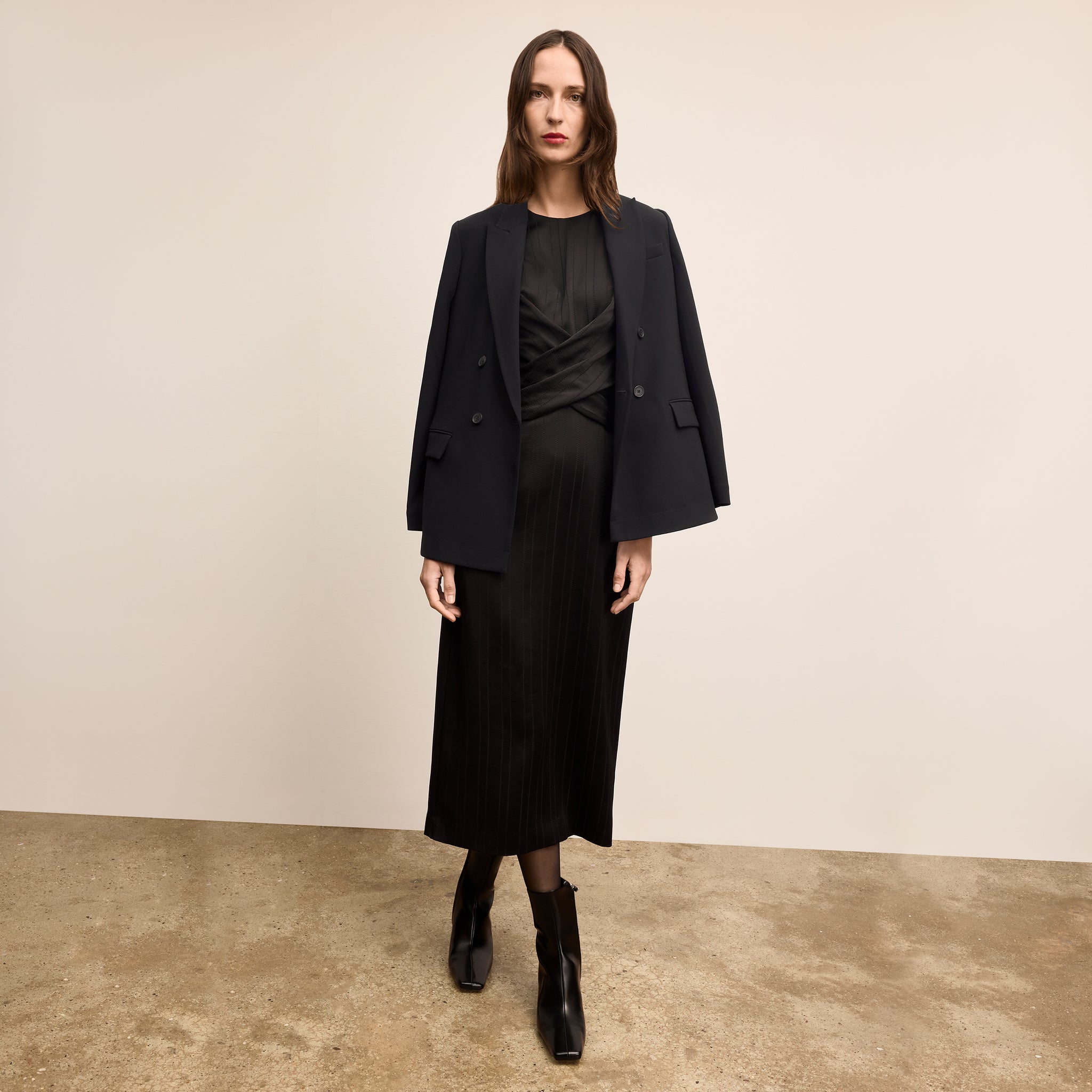 Woman wearing the O'Hara Blazer in Black over the Gabriette Dress in Black