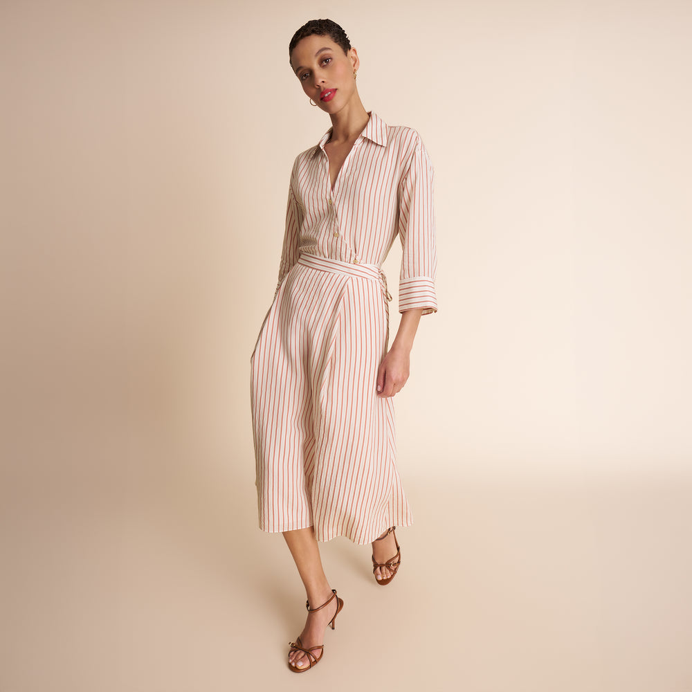 woman in stripped shirt and skirt.