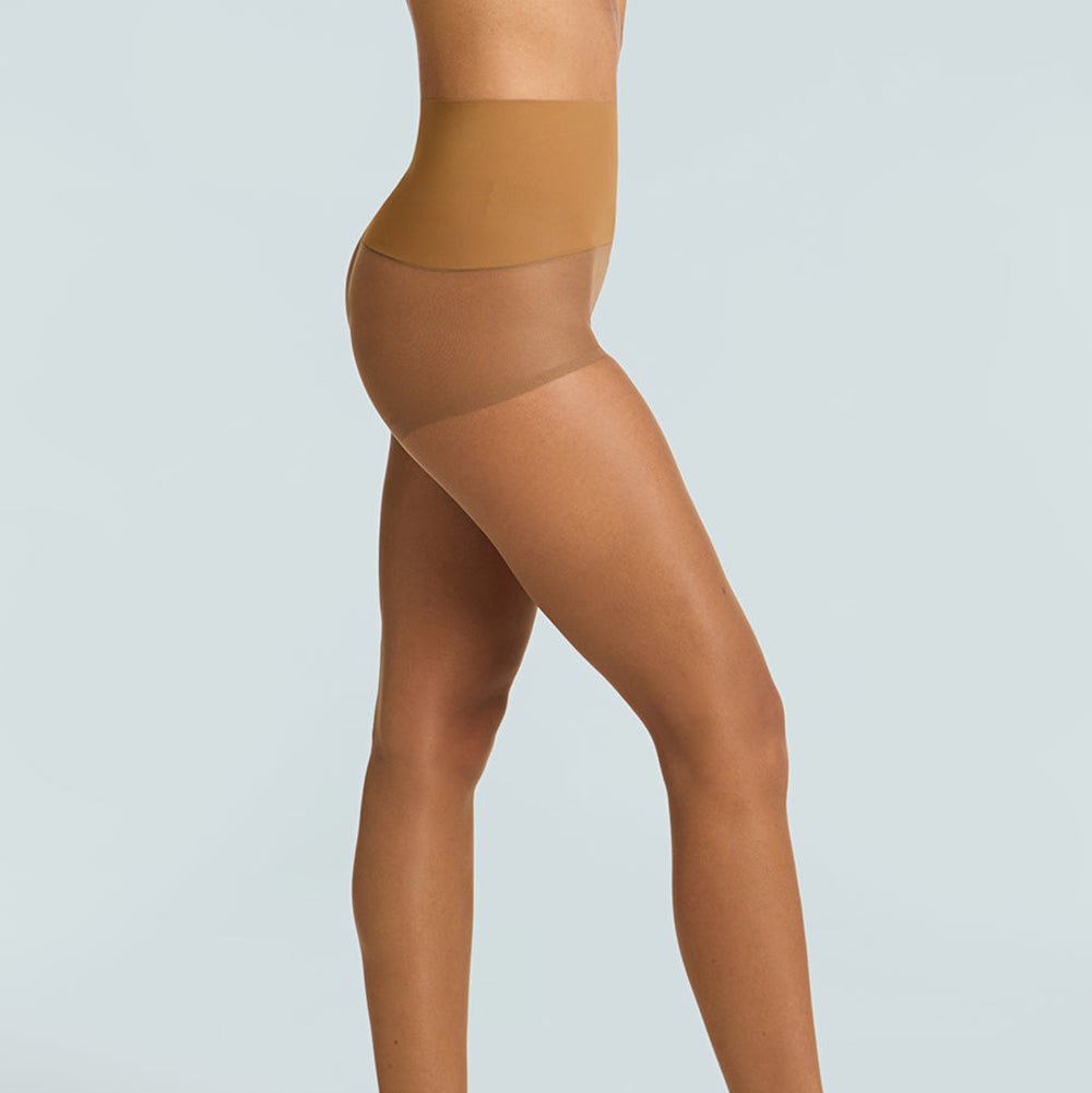 Beige sheer stockings worn by a model on a light gray background