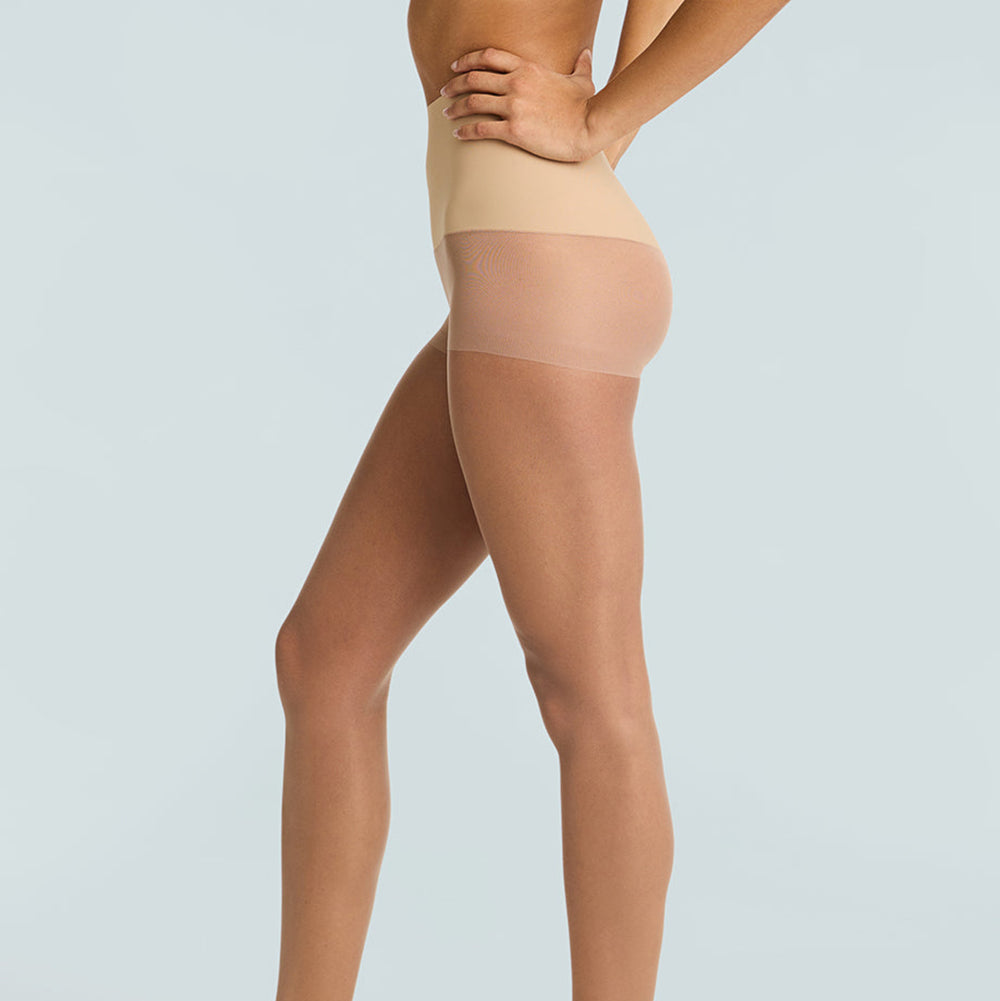 Beige sheer stockings worn by a model on a light gray background