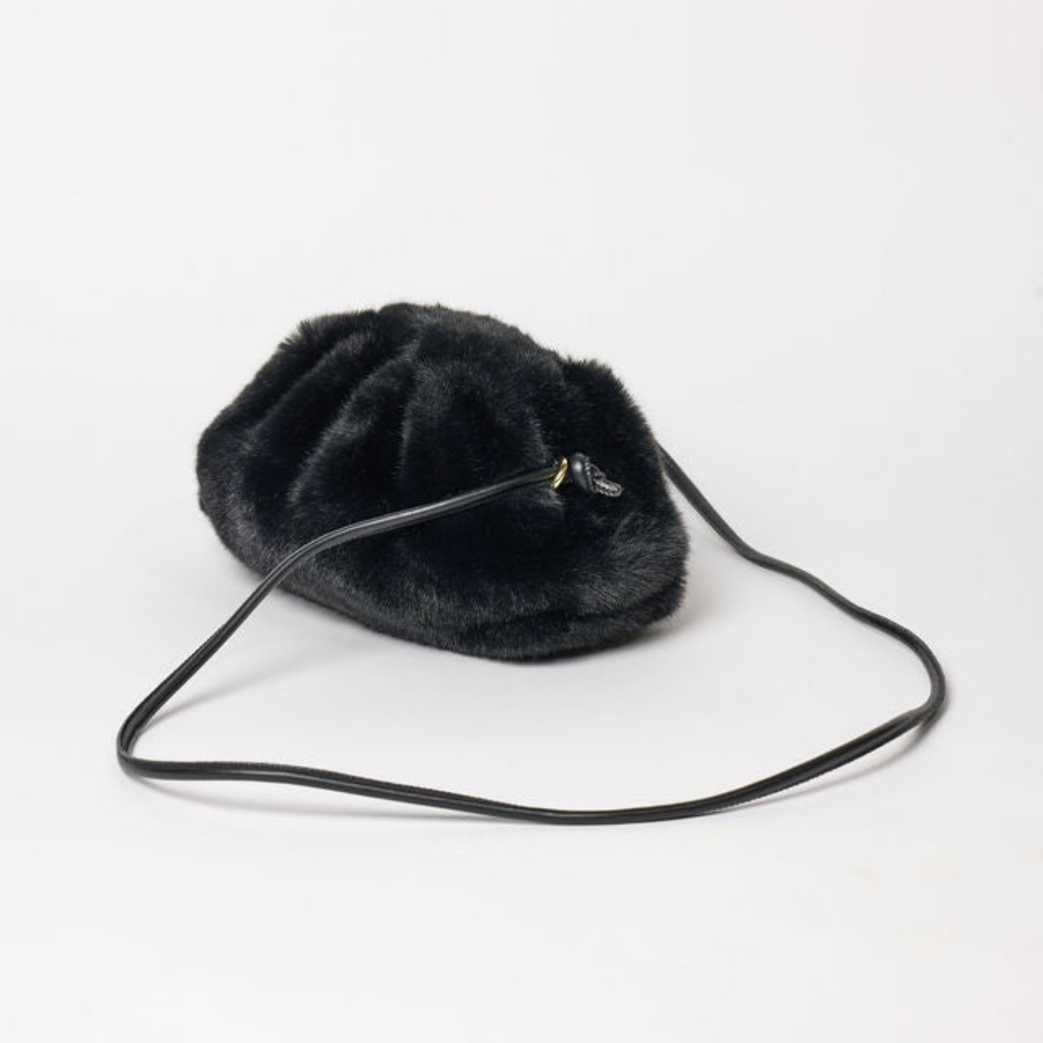 Black fur handbag on a white background