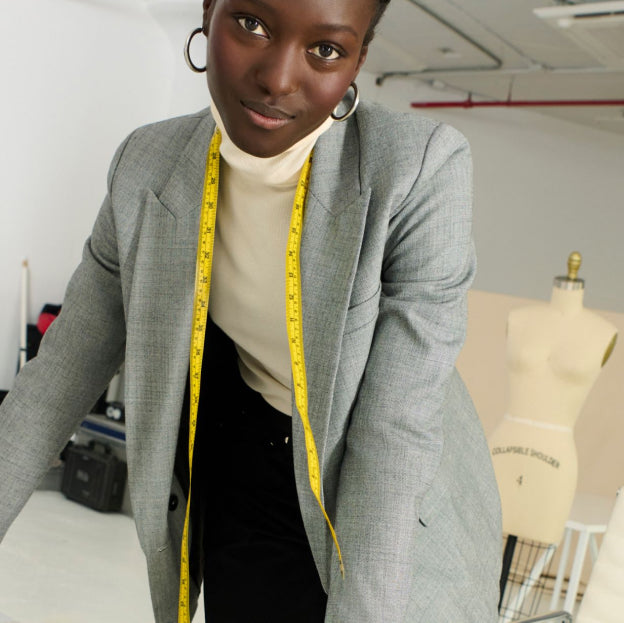 Image of a woman wearing a tape measure around her neck