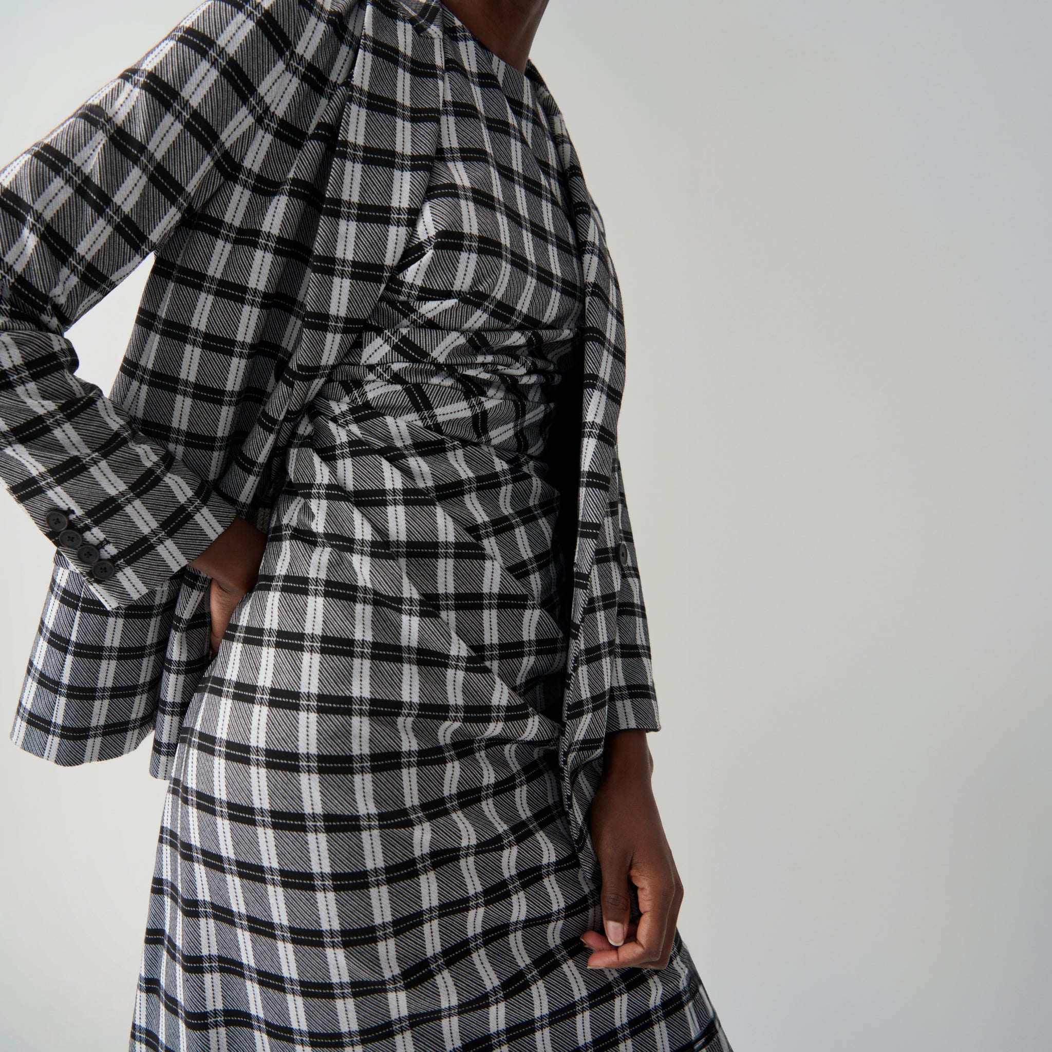 front image of a woman wearing the jeannine dress in checkmate