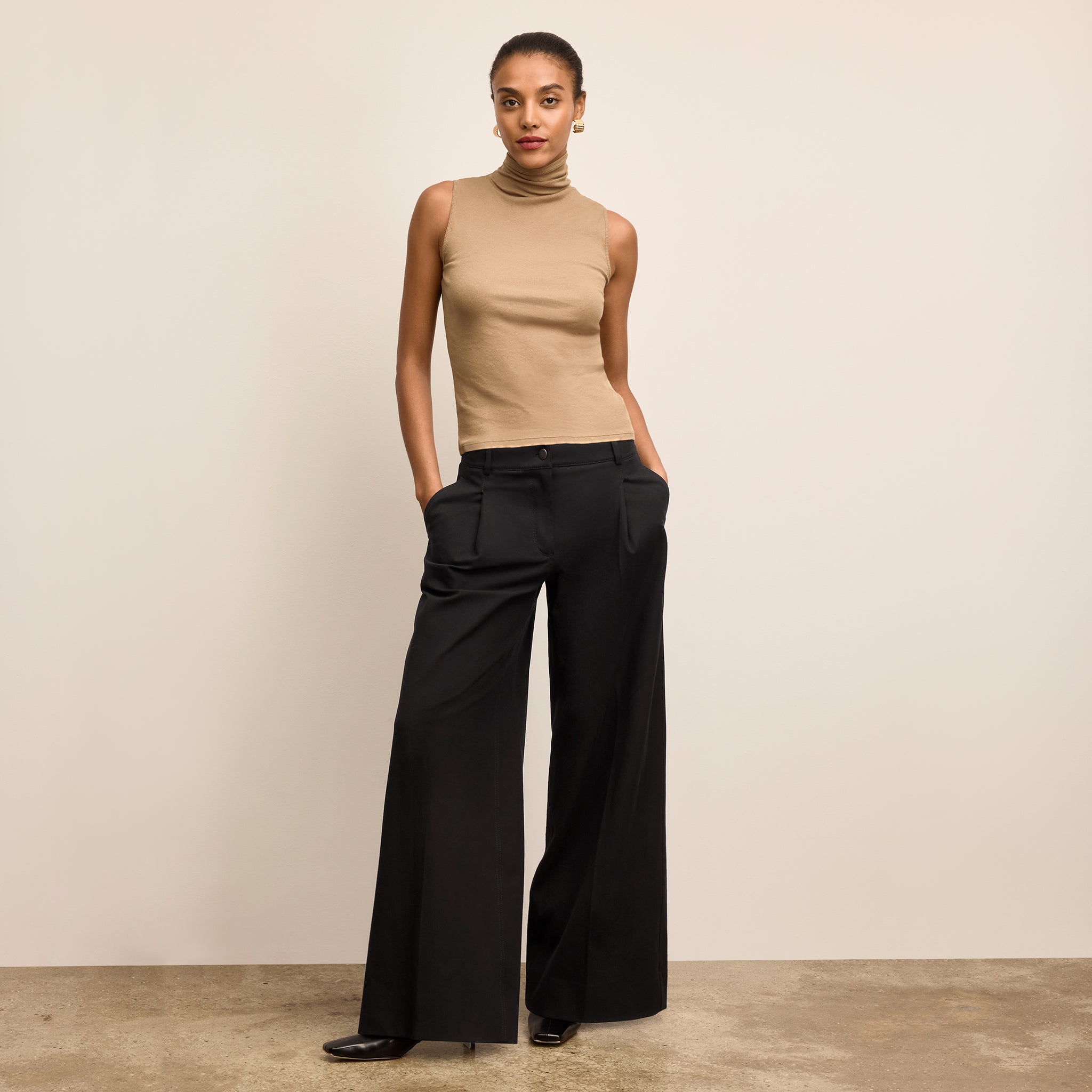 Front image of a woman wearing the Harrison Pant in Black