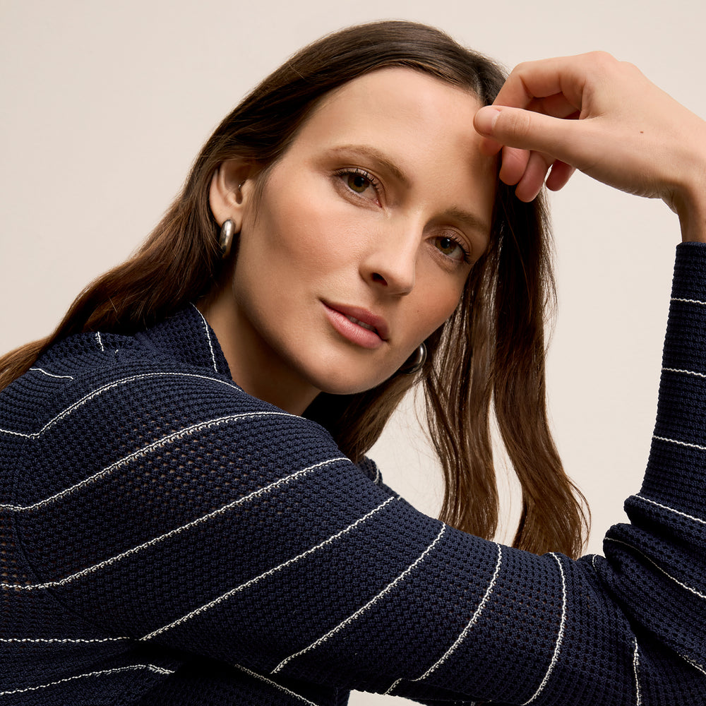 detail image of a woman wearing the jolie jardigan in dot knit