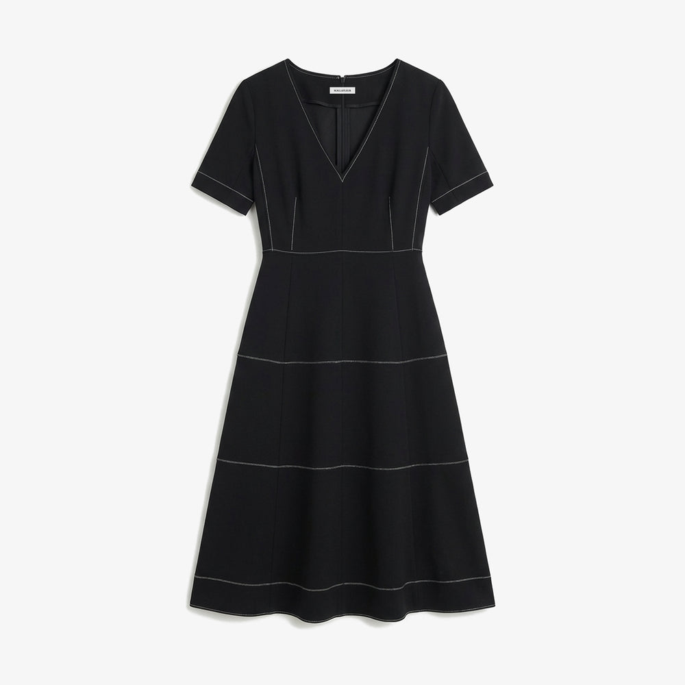 Black dress with white stitching on a white background