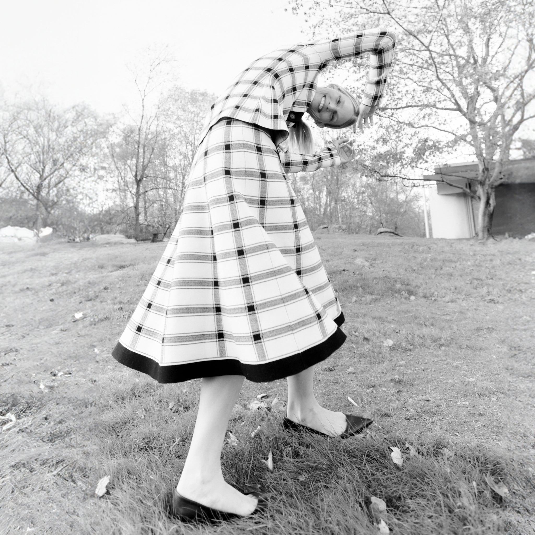 front image of a woman wearing the marlowe skirt in bold check