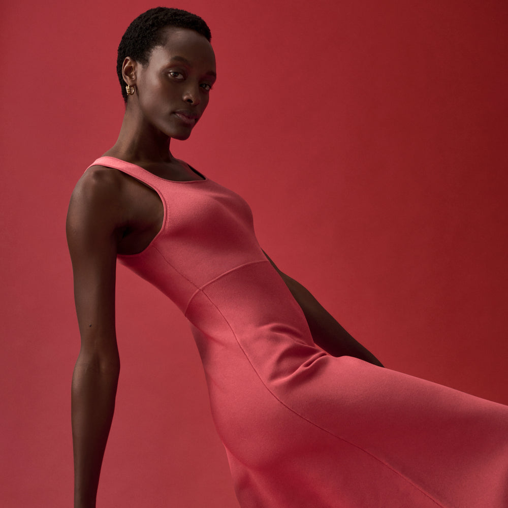 front image of a woman wearing the lottie dress in carnation