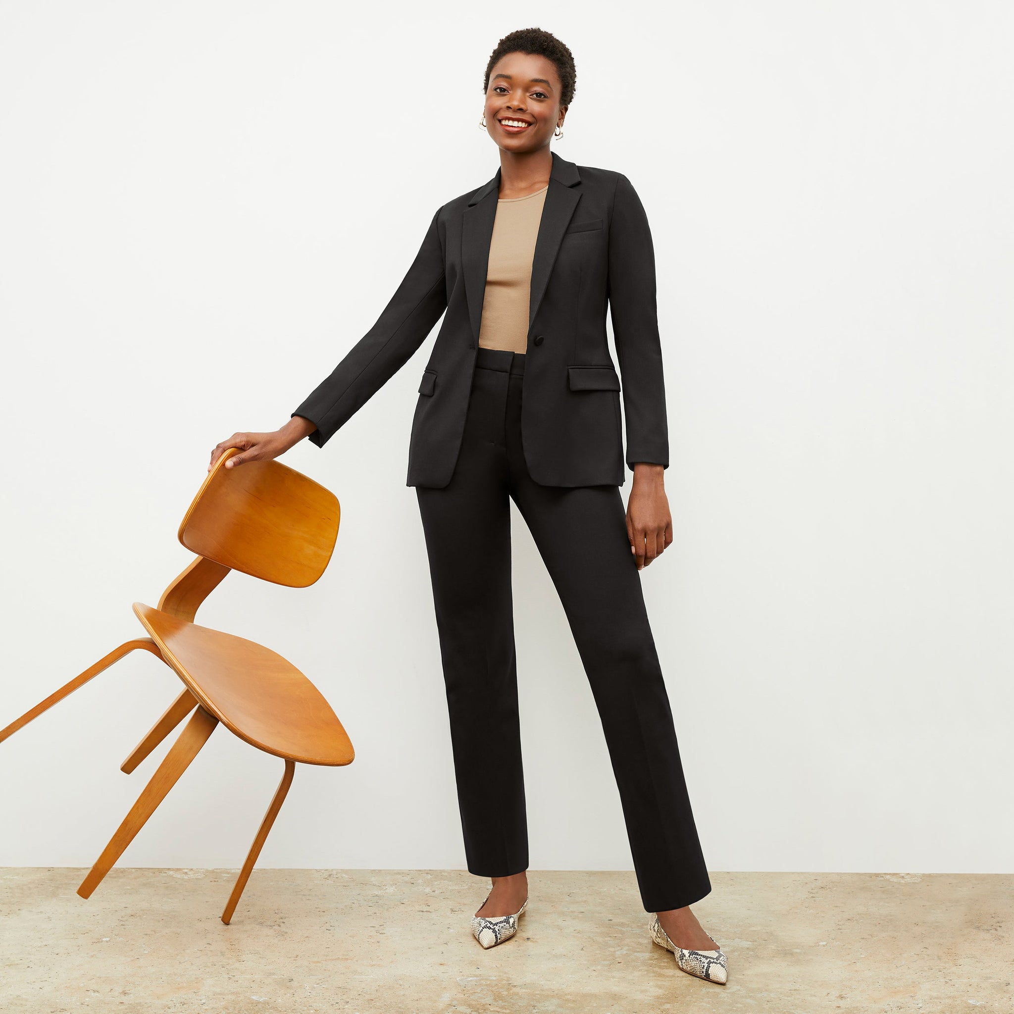 Front image of a woman wearing the Yiyan Blazer in Black