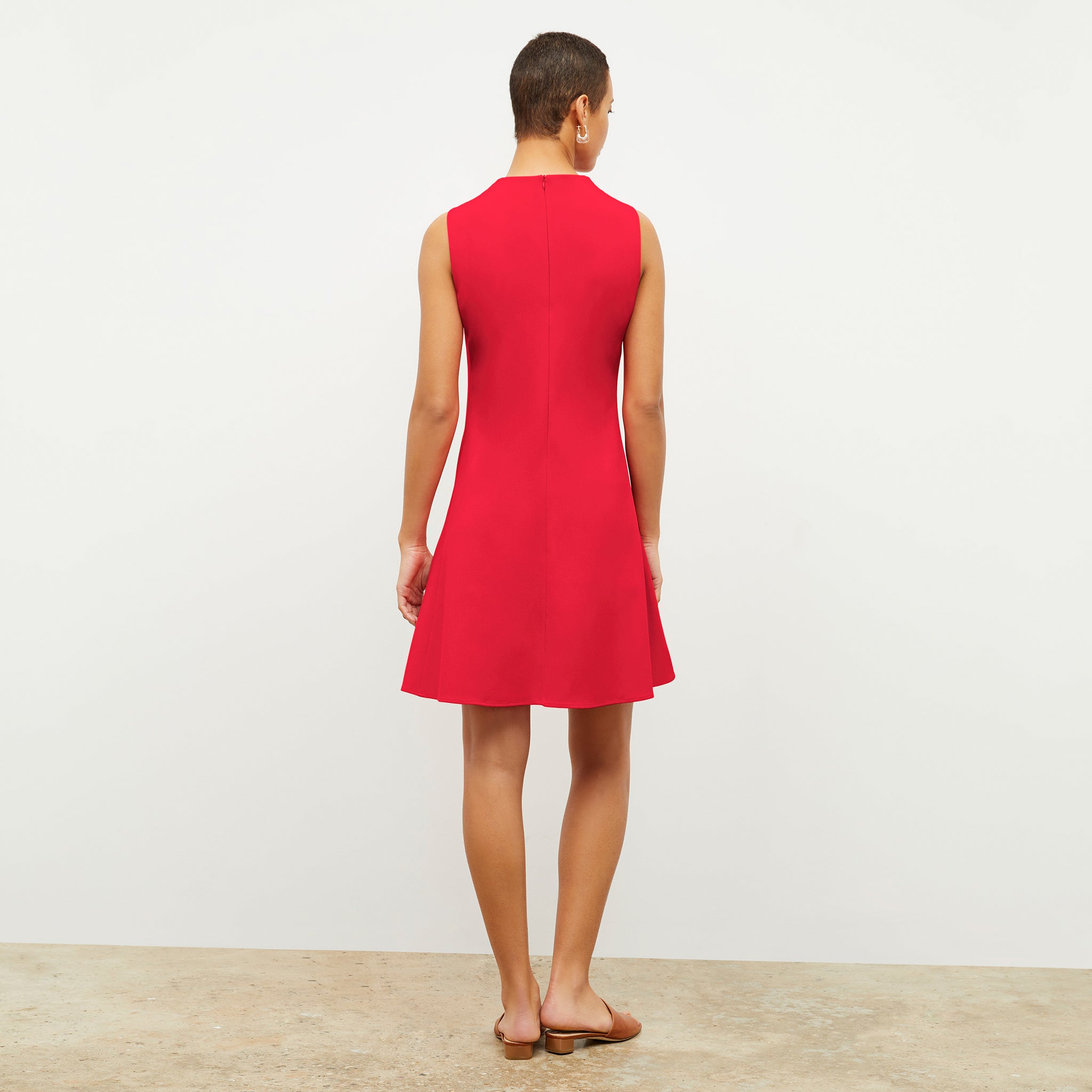 Back image of a woman wearing the malala dress in flame