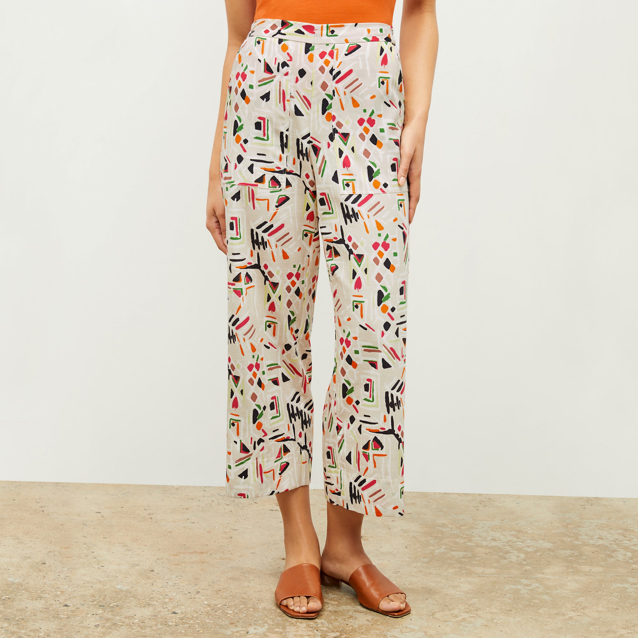 front image of a woman wearing the madelyn pant in rhythm print 