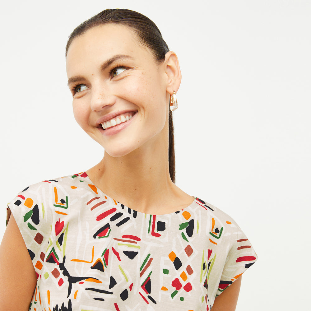 front image of a woman wearing the maaza dress in rhythm print