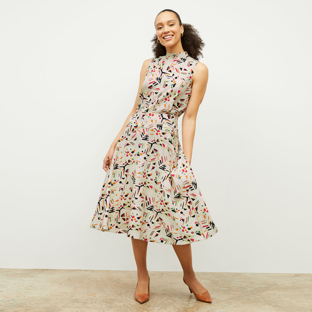 front image of a woman wearing the oona dress in rhythm print