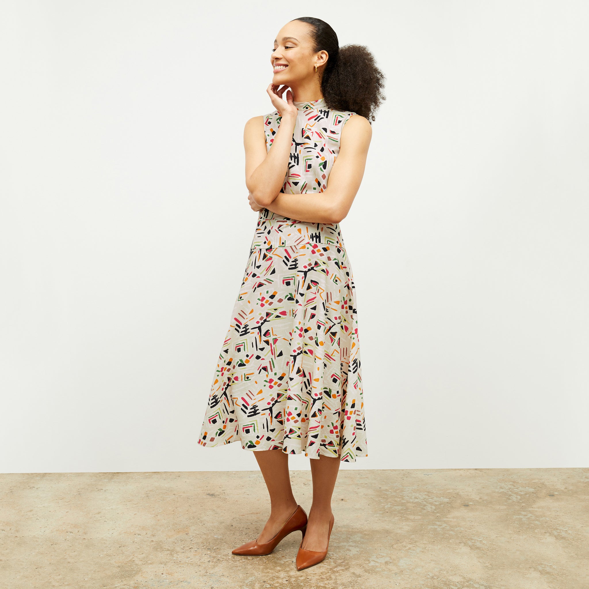 front image of a woman wearing the oona dress in rhythm print