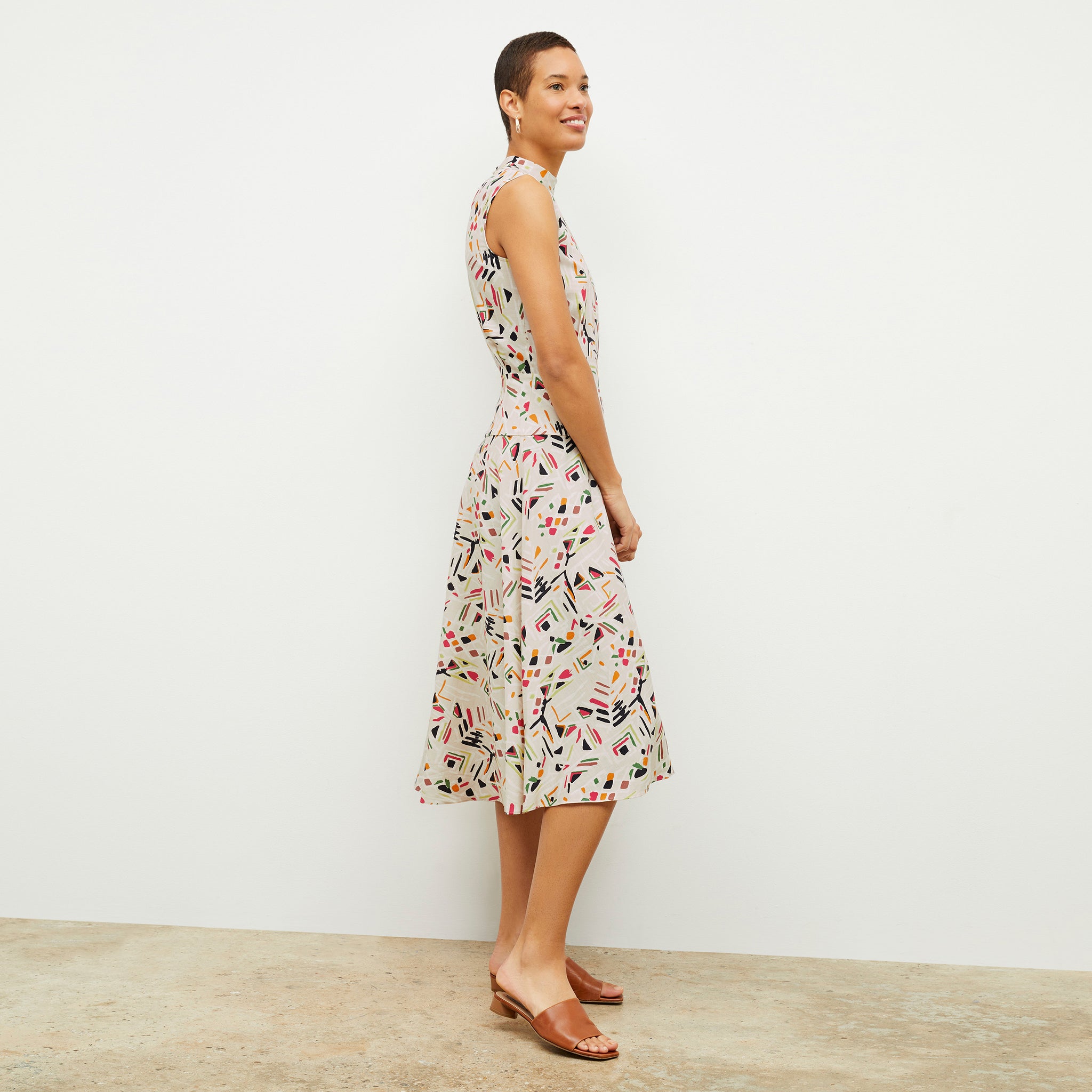 side image of a woman wearing the oona dress in rhythm print