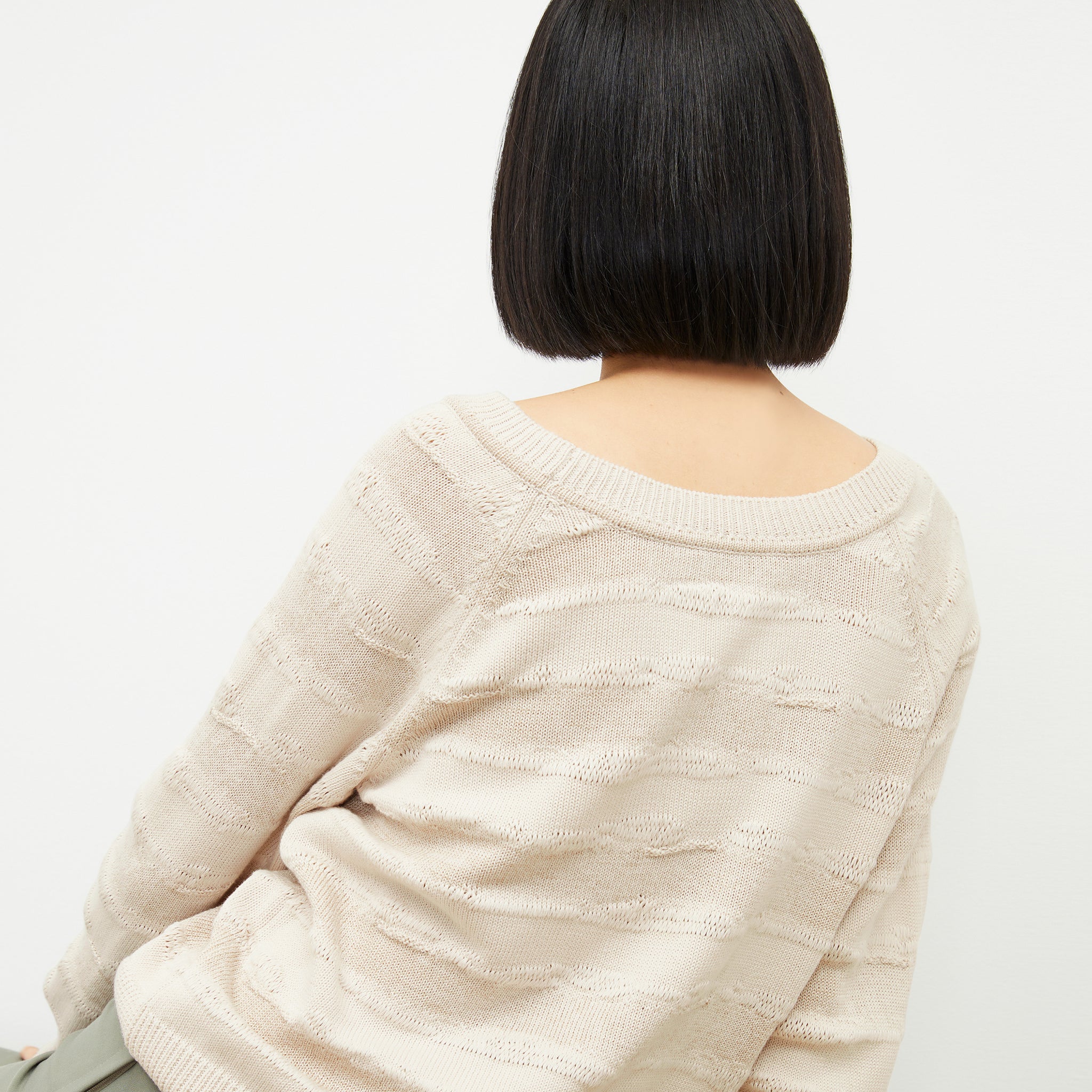 back image of a woman wearing the jo sweater in moonbeam