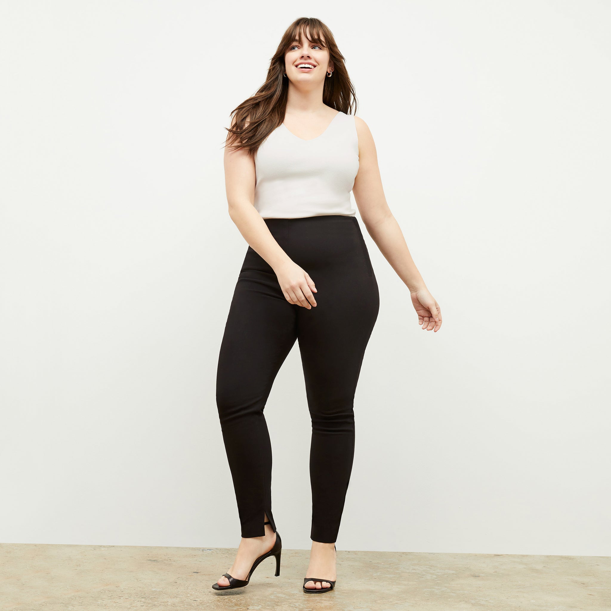 Front image of a woman wearing the skinny foster in black
