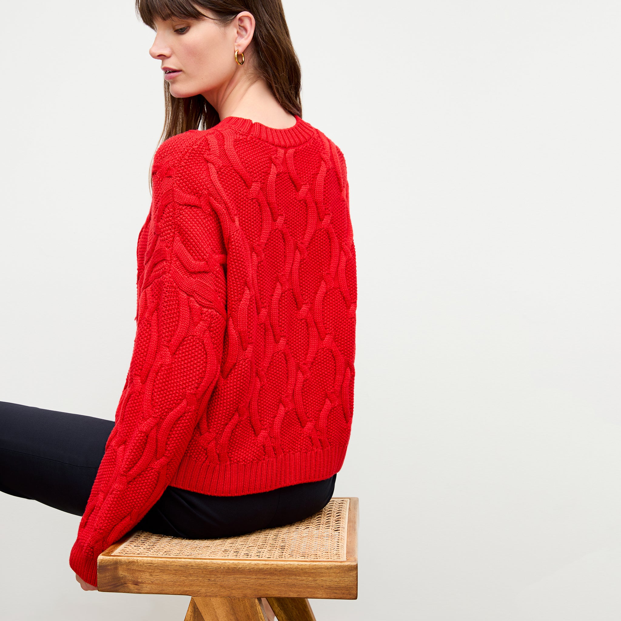 back image of a woman wearing the kiki sweater in strawberry 