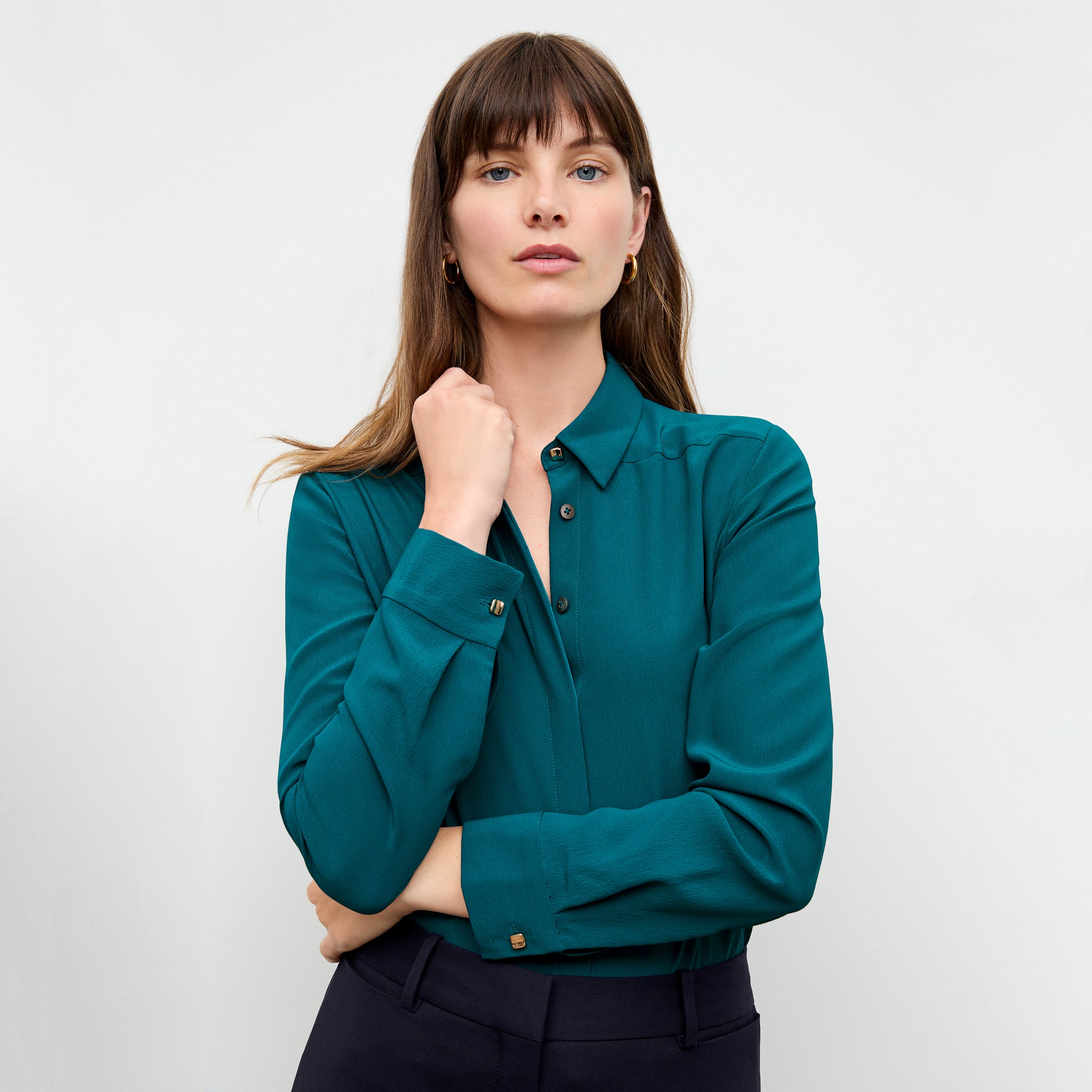 front image of a woman wearing the lagarde top in mineral blue