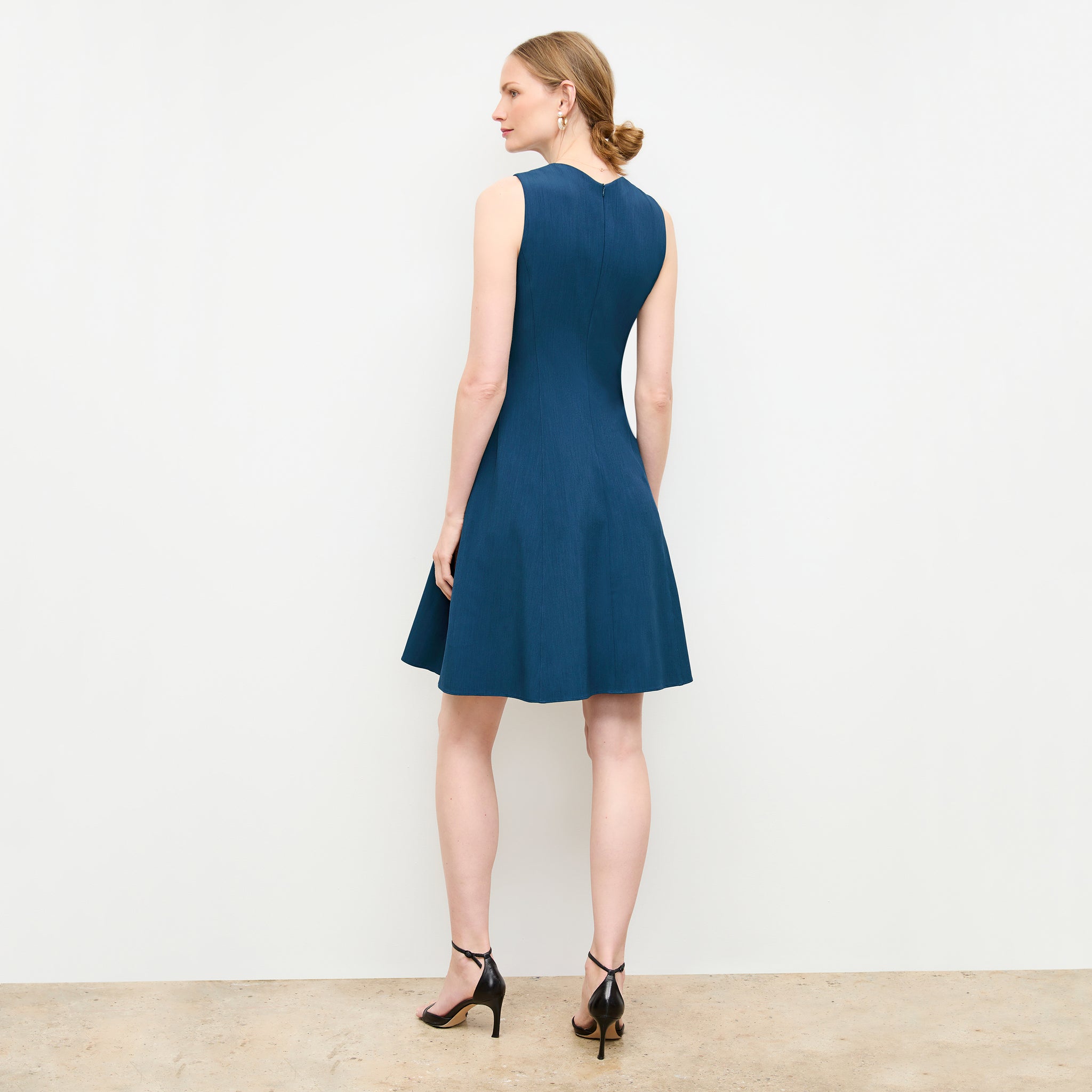 back image of a woman wearing the jaycie dress in deep teal