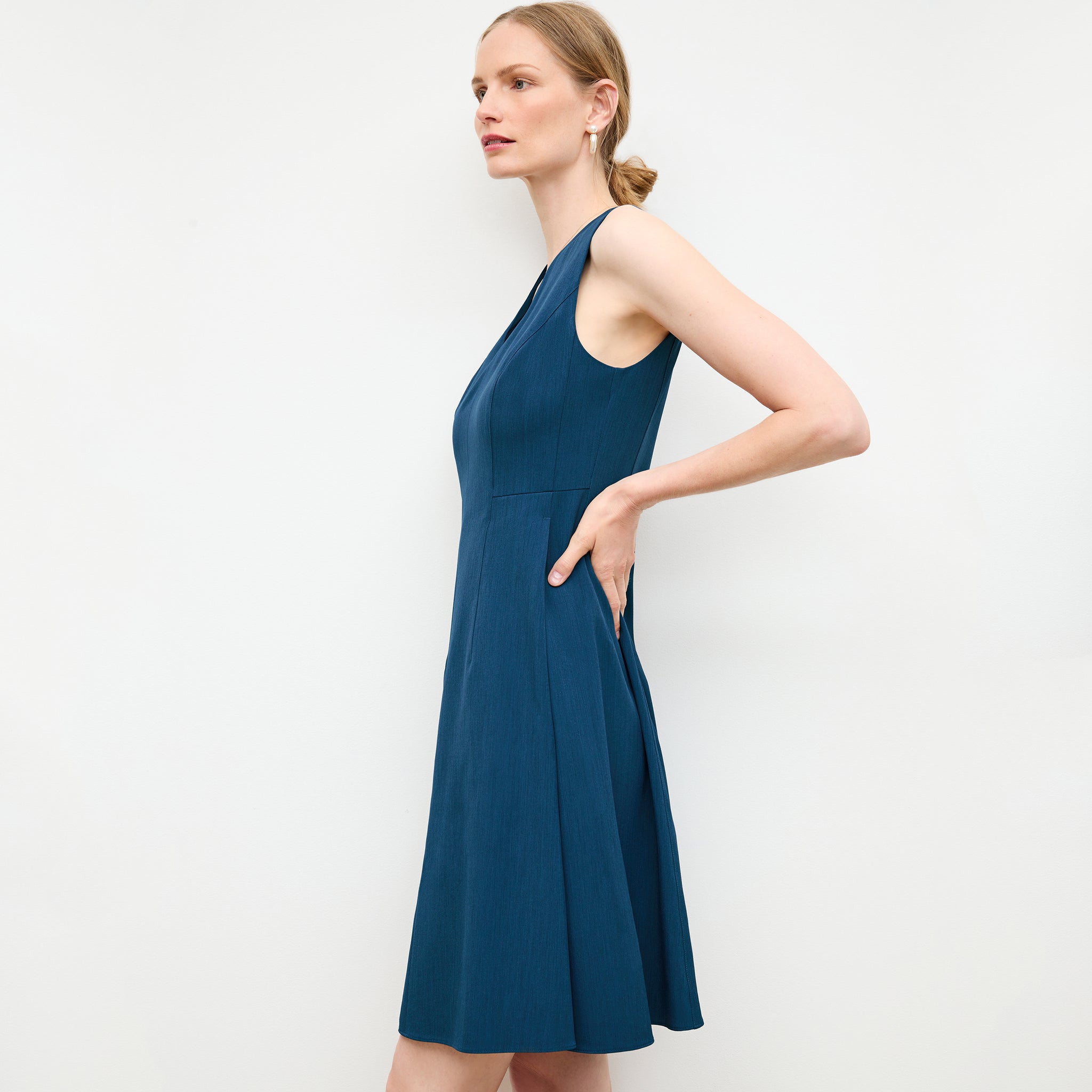 side image of a woman wearing the jaycie dress in deep teal