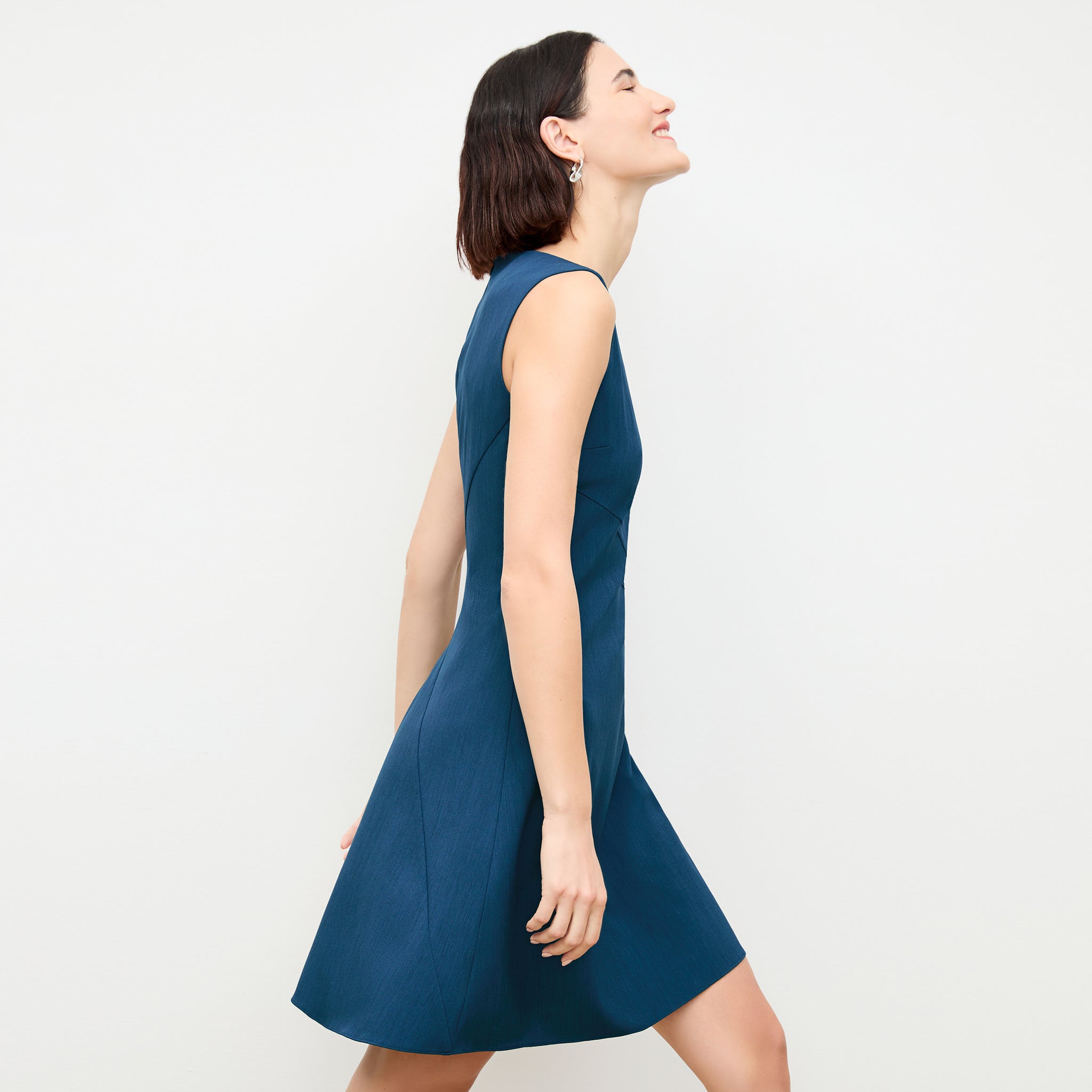side image of a woman wearing the pauline dress in deep teal