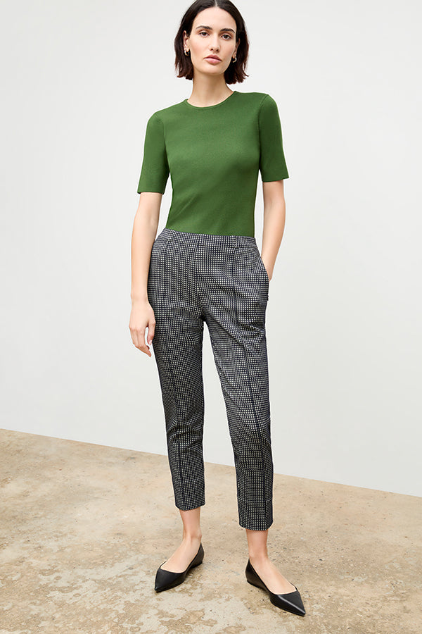 front image of a woman wearing the colby pant in stretch houndstooth