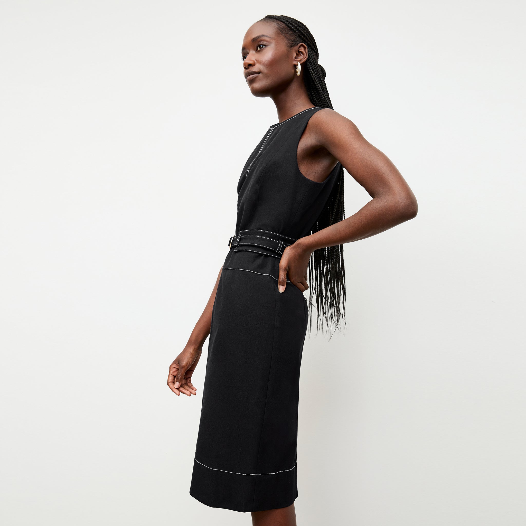 side image of a woman wearing the maude dress in black