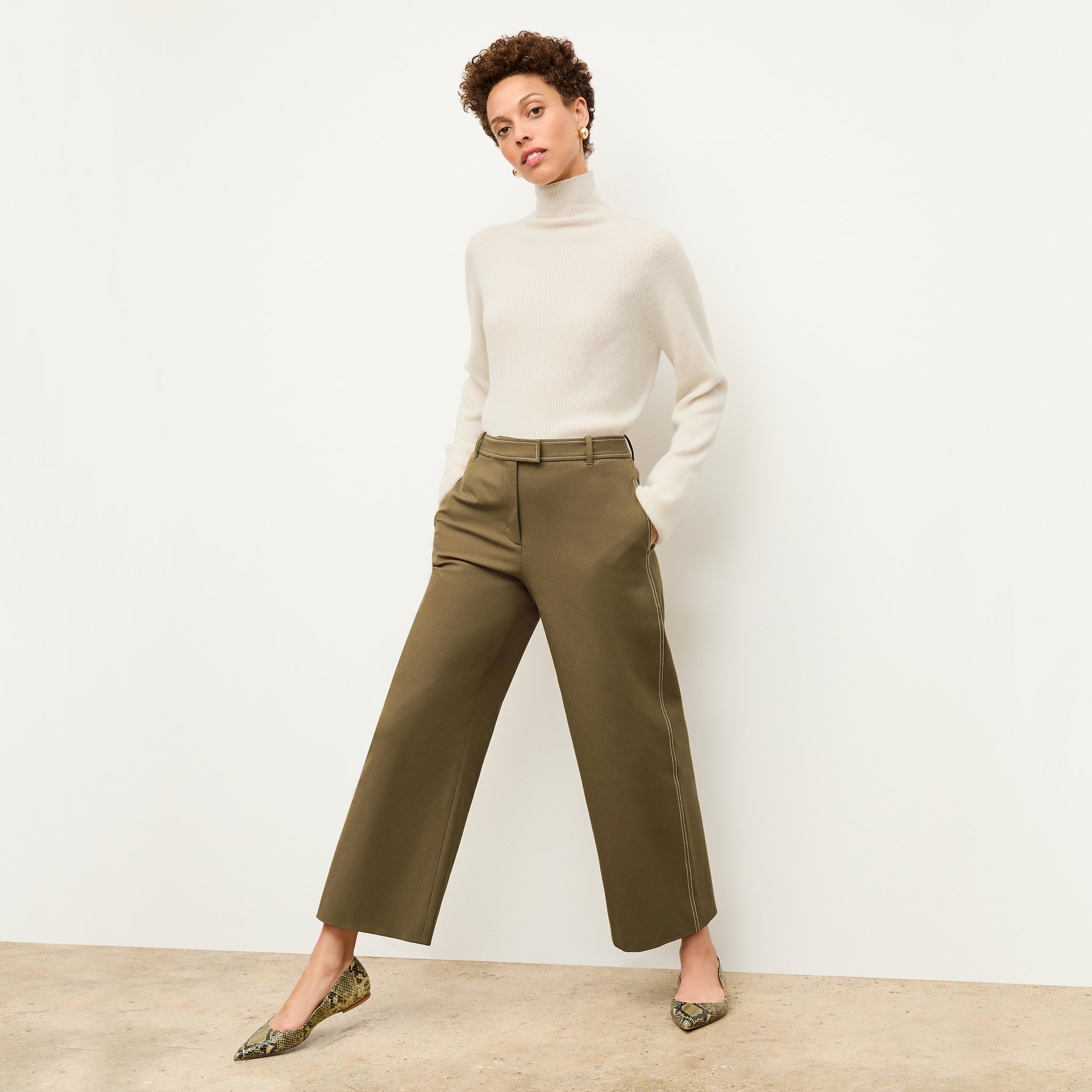 front image of a woman wearing the abby pant in oregano 