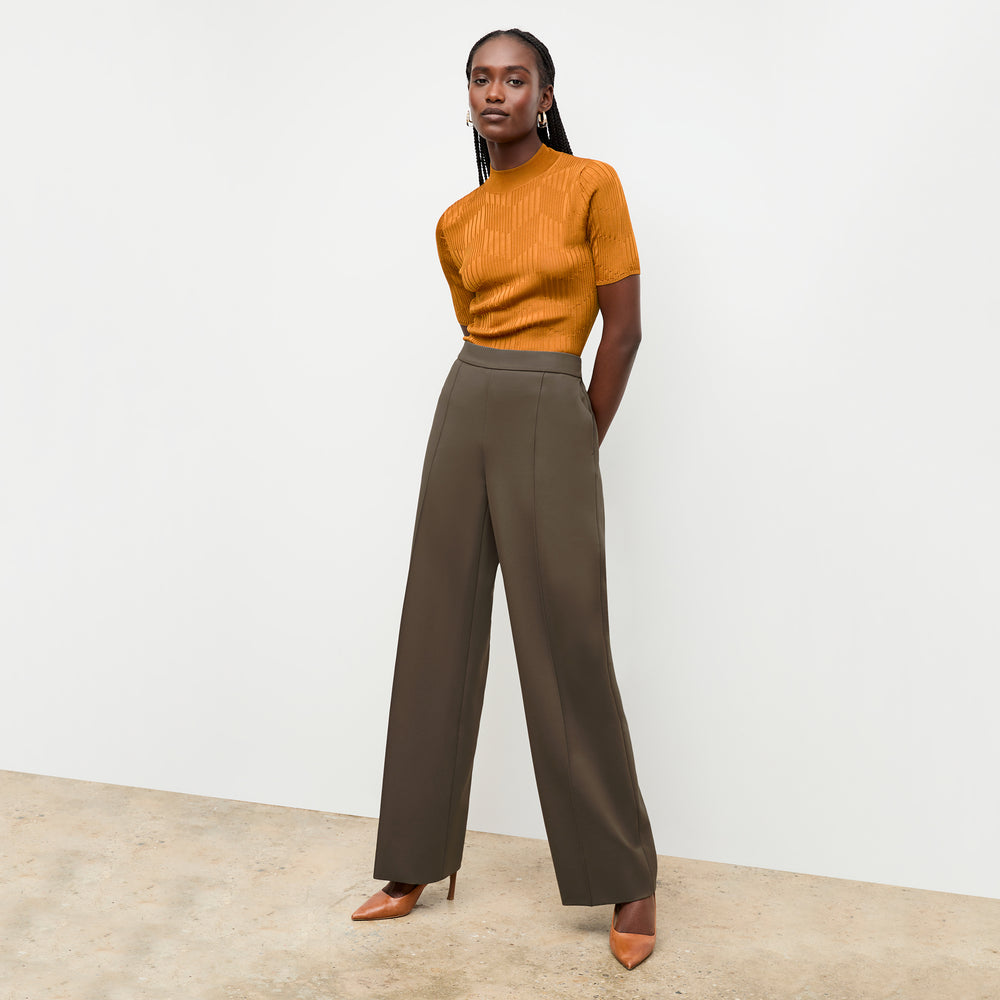 front image of a woman wearing the montean top in caramel
