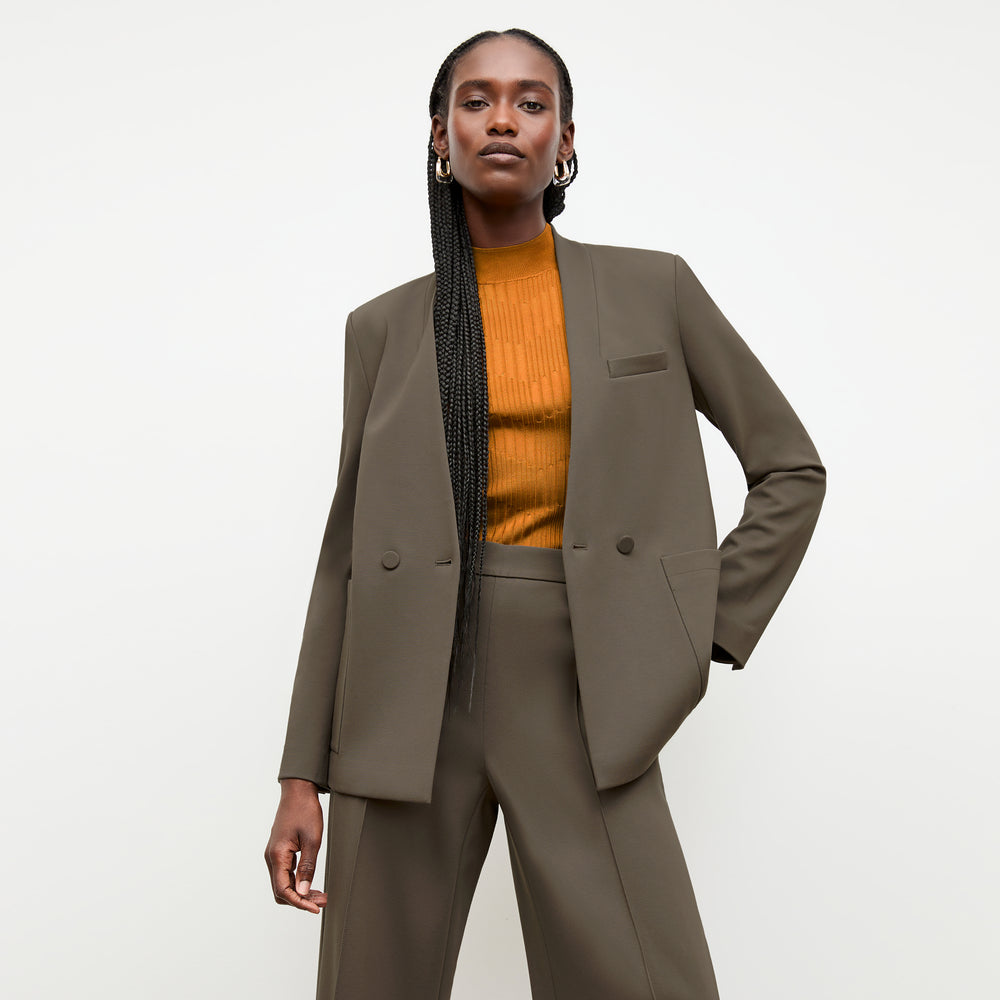 front image of a woman wearing the montean top in caramel