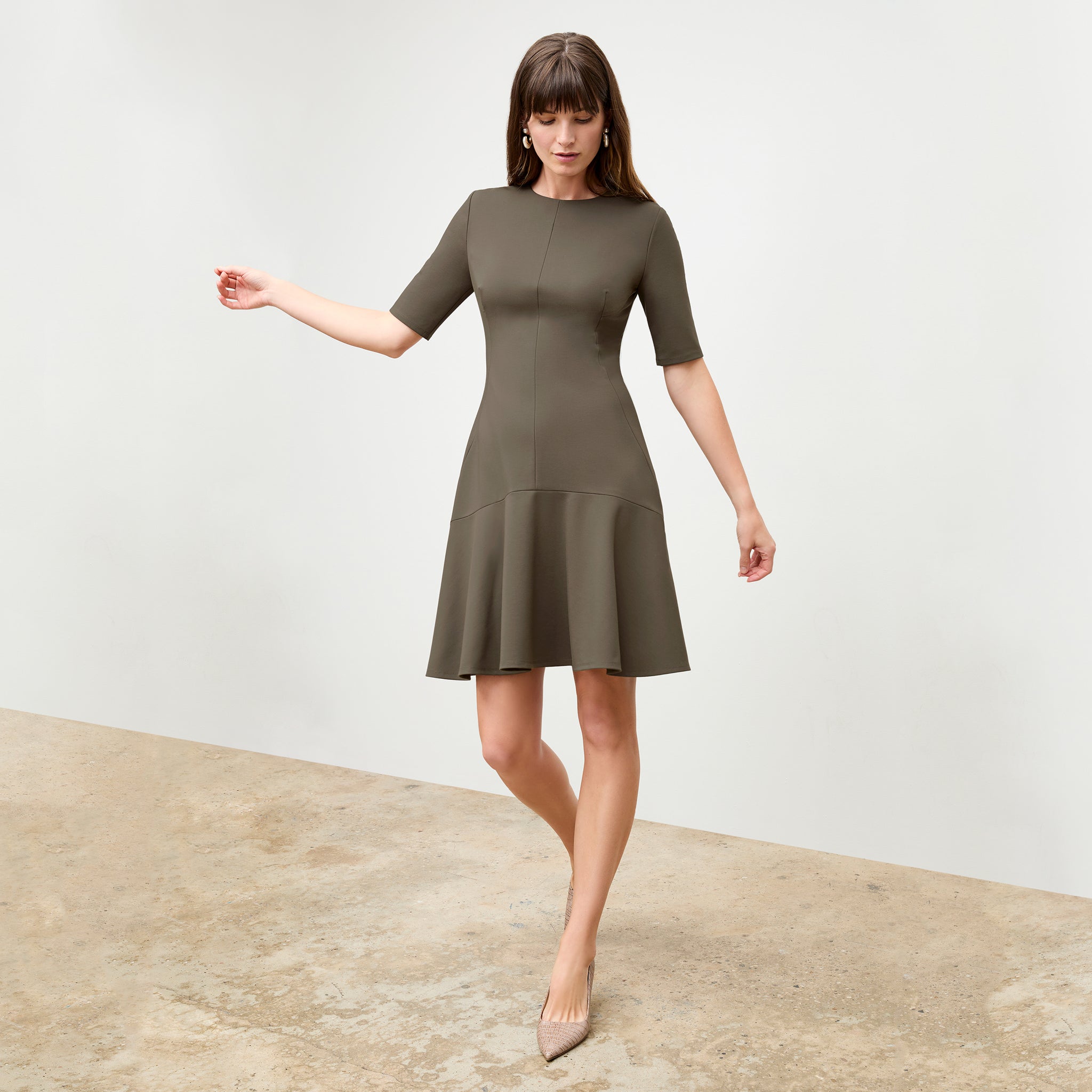 front image of a woman wearing the gina dress in ash 