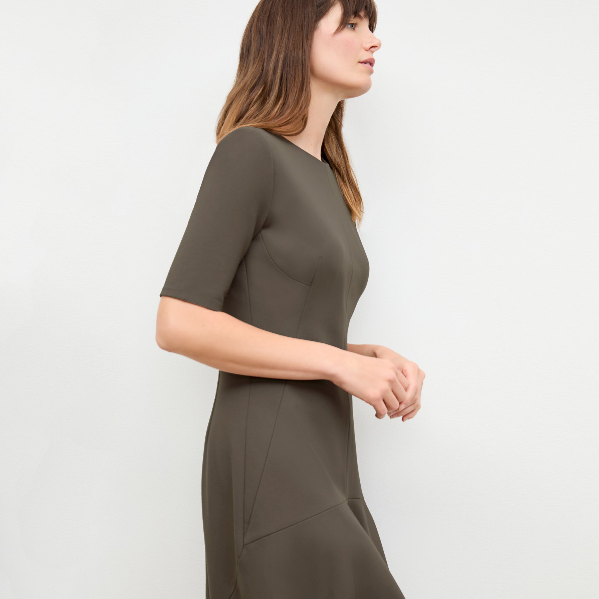 side image of a woman wearing the gina dress in ash