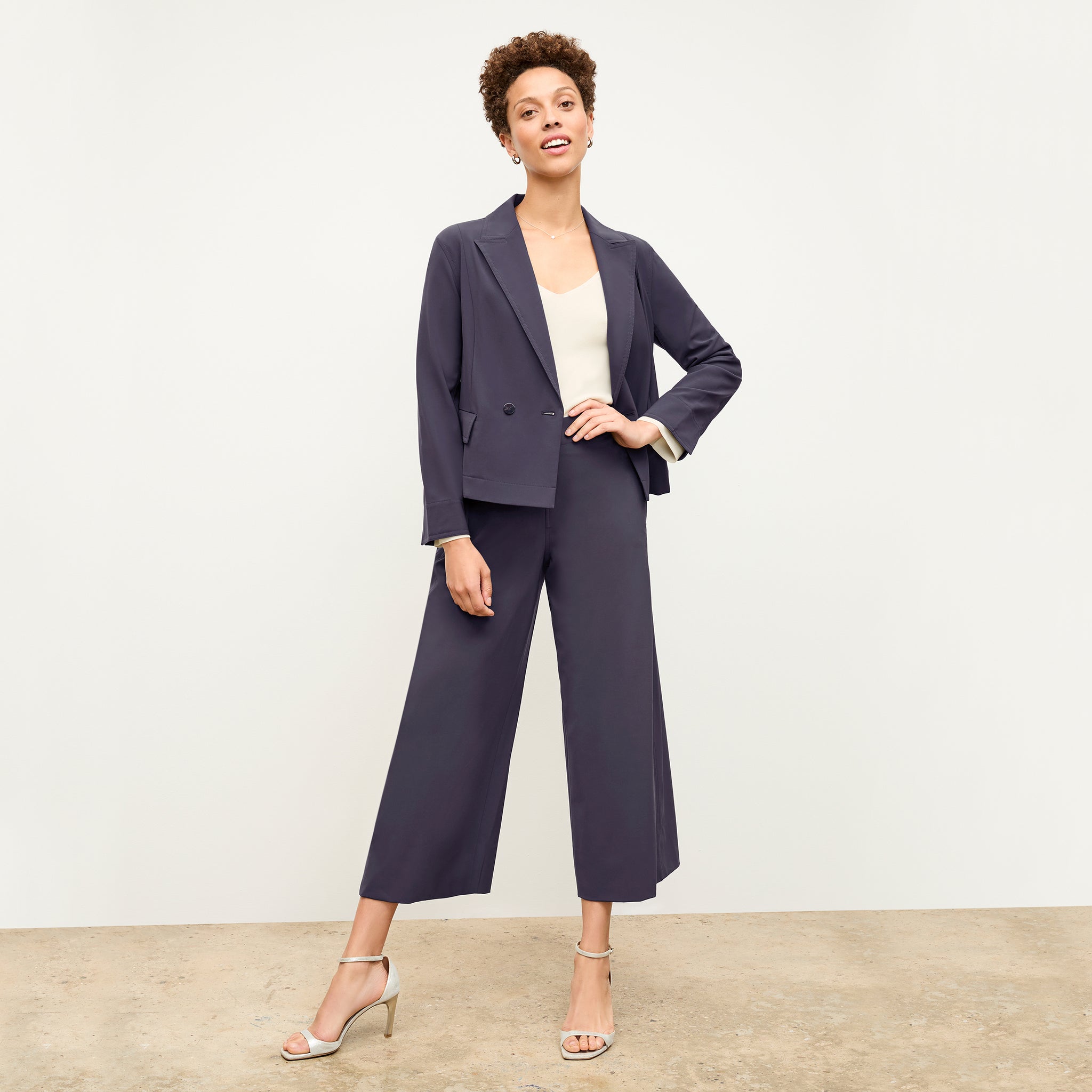 front image of a woman wearing the elena pant in cool charcoal