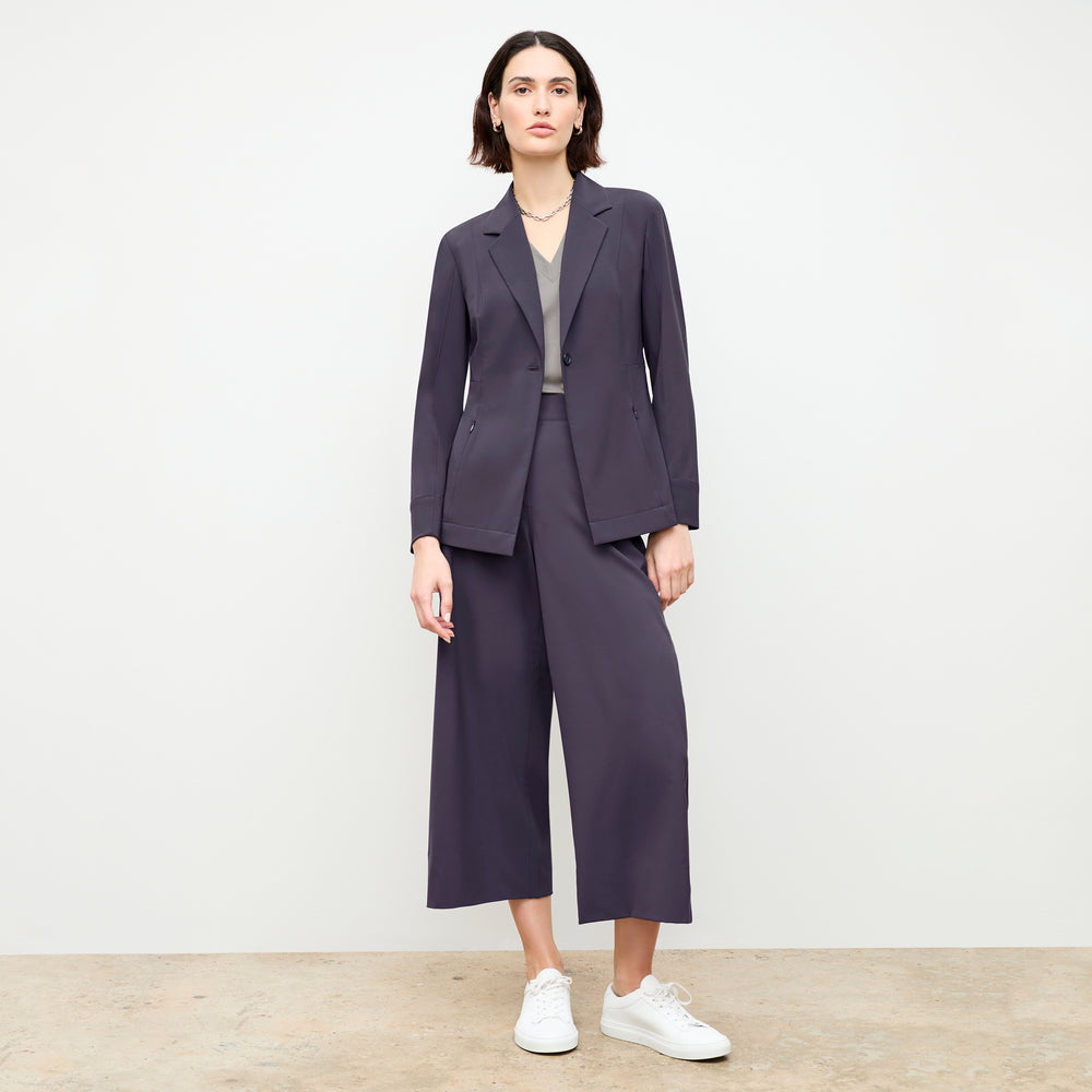 front image of a woman wearing the elena pant in cool charcoal