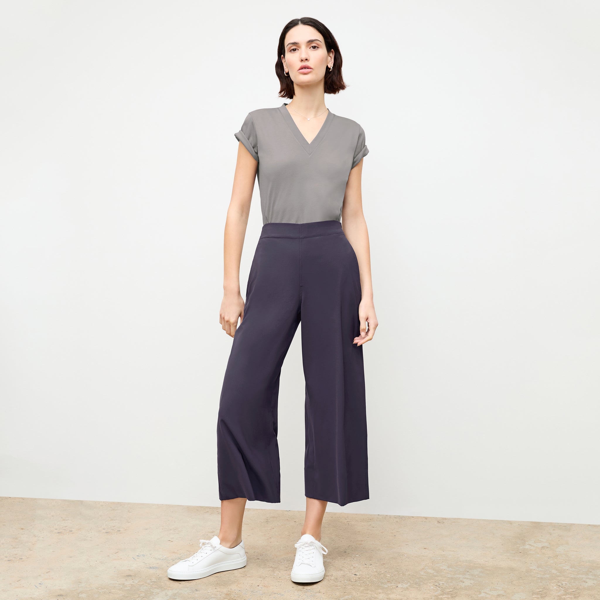 front image of a woman wearing the elena pant in cool charcoal