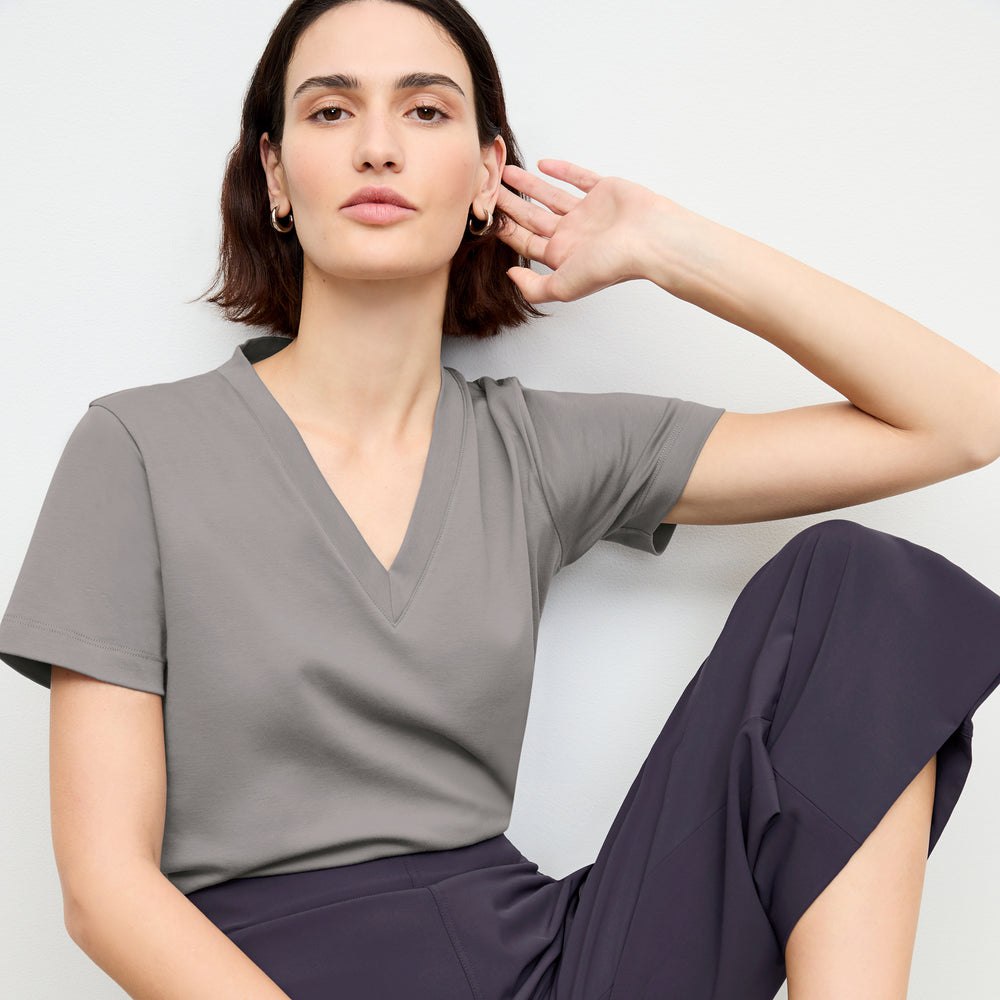 front image of a woman wearing the elena pant in cool charcoal