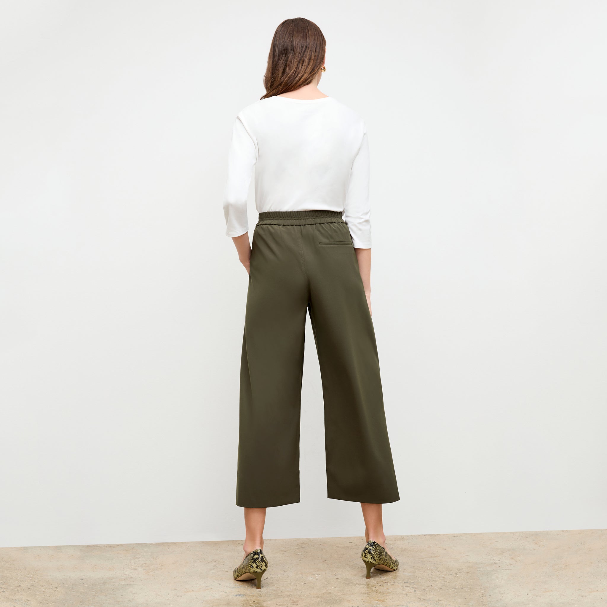 back image of a woman wearing the elena pant in olive