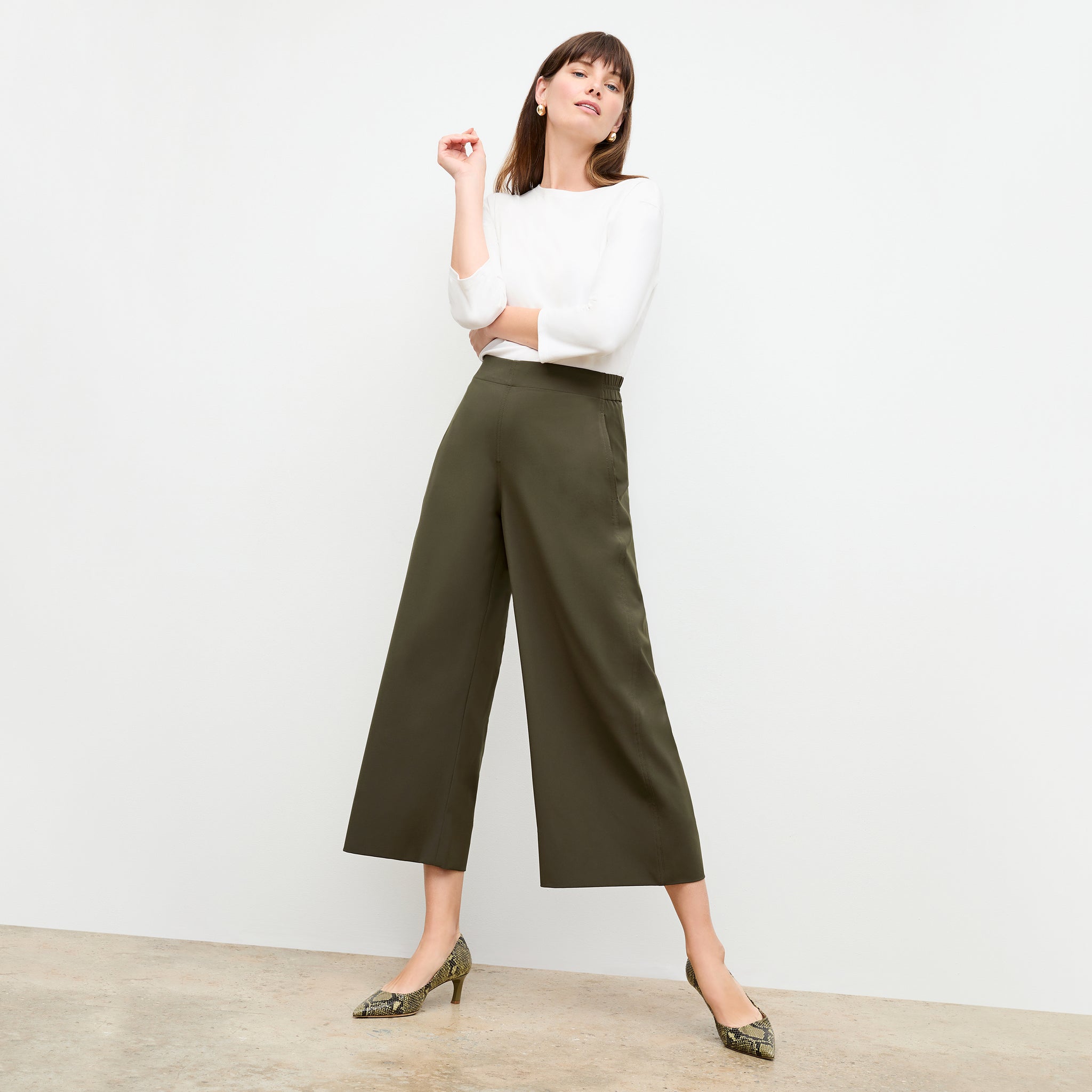 front image of a woman wearing the elena pant in olive 