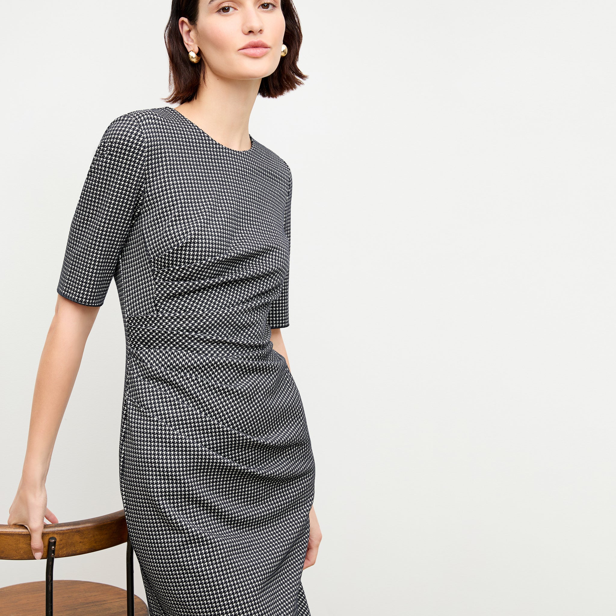 front image of a woman wearing the ciela dress in stretch houndstooth
