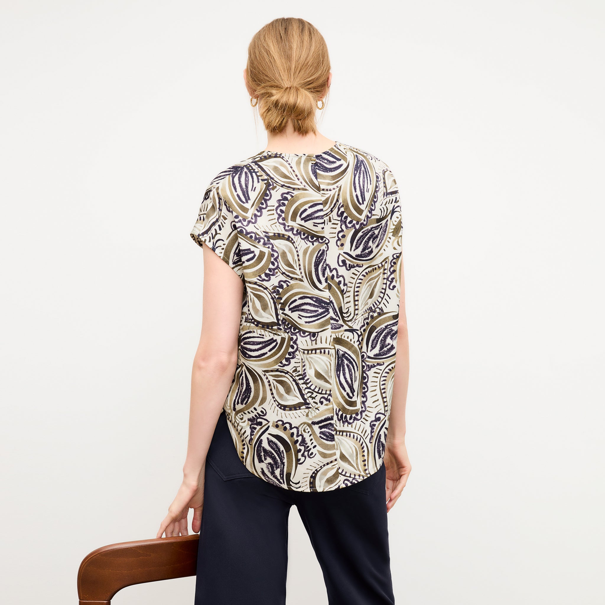 back image of a woman wearing the didion top in brushstroke paisley