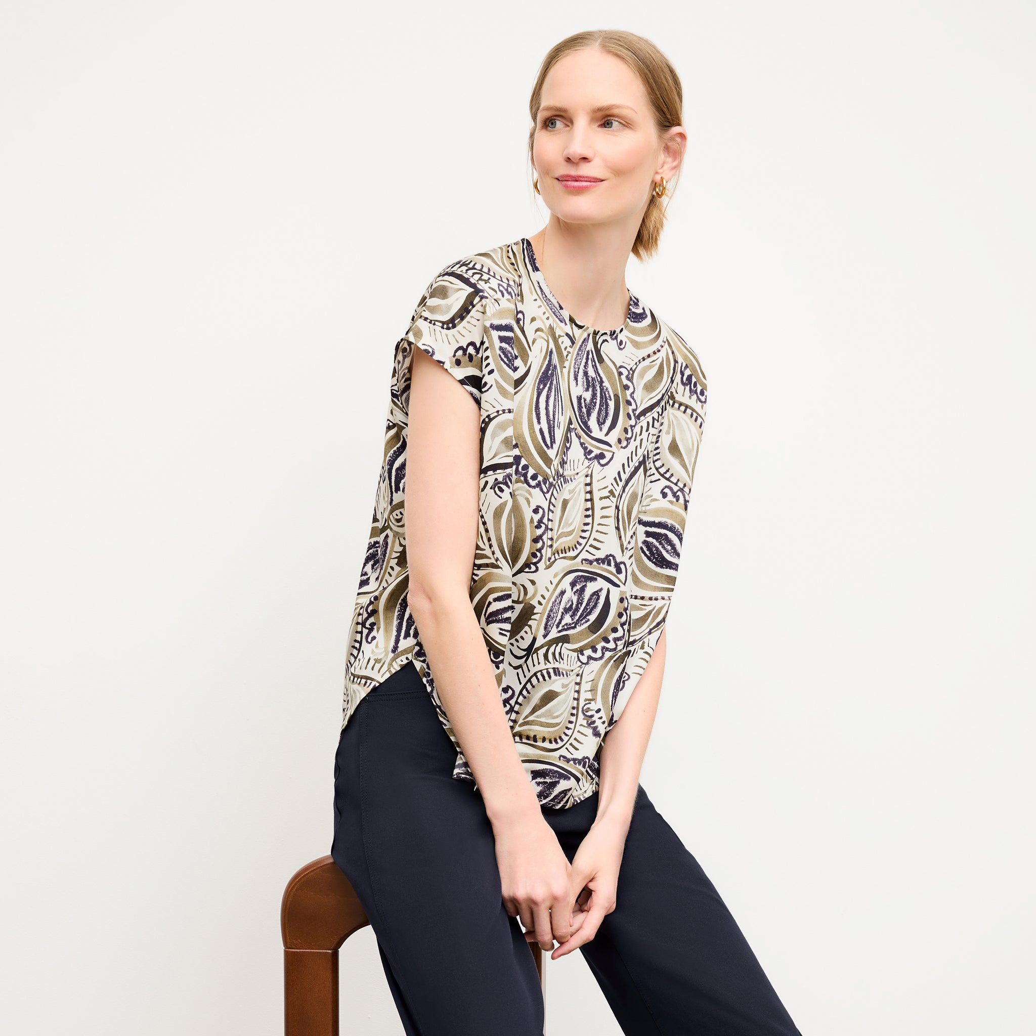 front image of a woman wearing the didion top in brushstroke paisley 