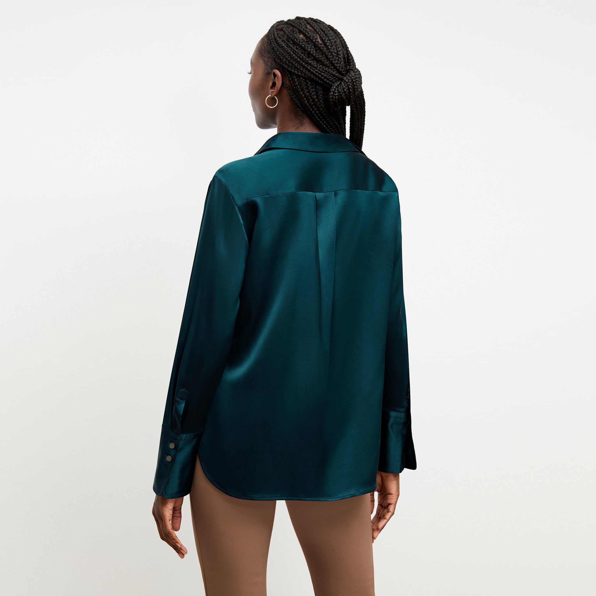 Back image of a woman wearing the tatum top in lagoon