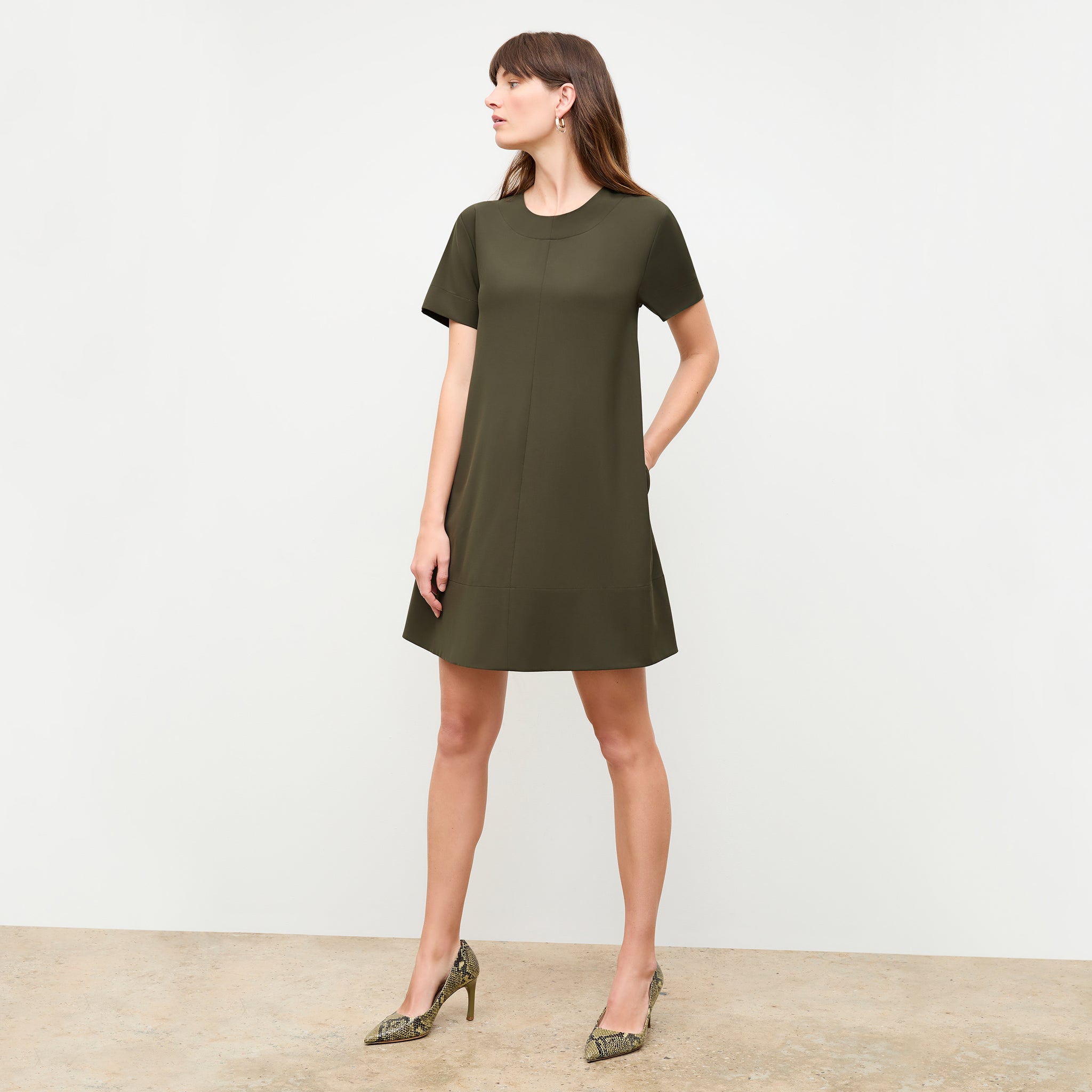 Front image of a woman wearing the Corrie Dress in Olive