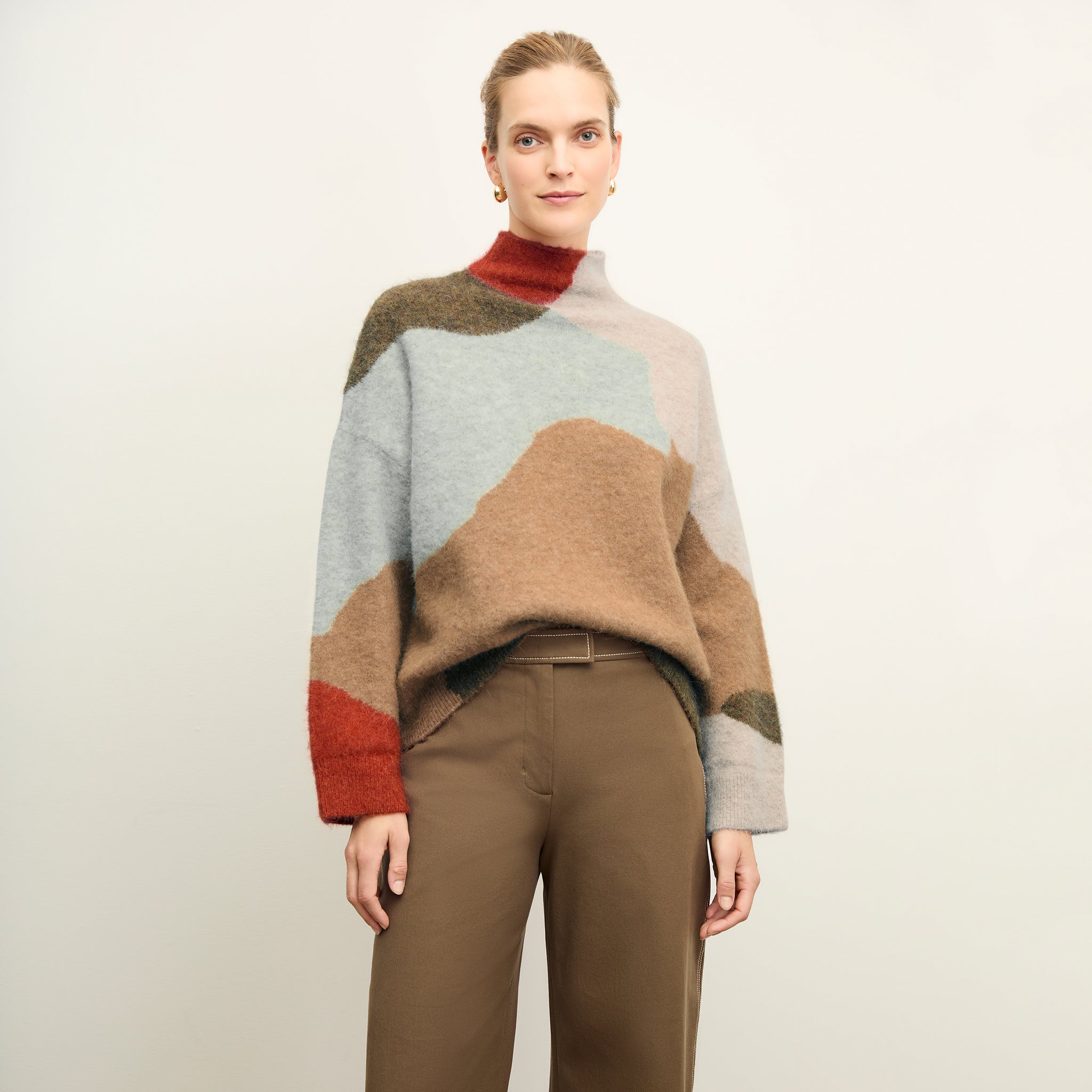 front image of a woman wearing the rajni sweater in multi