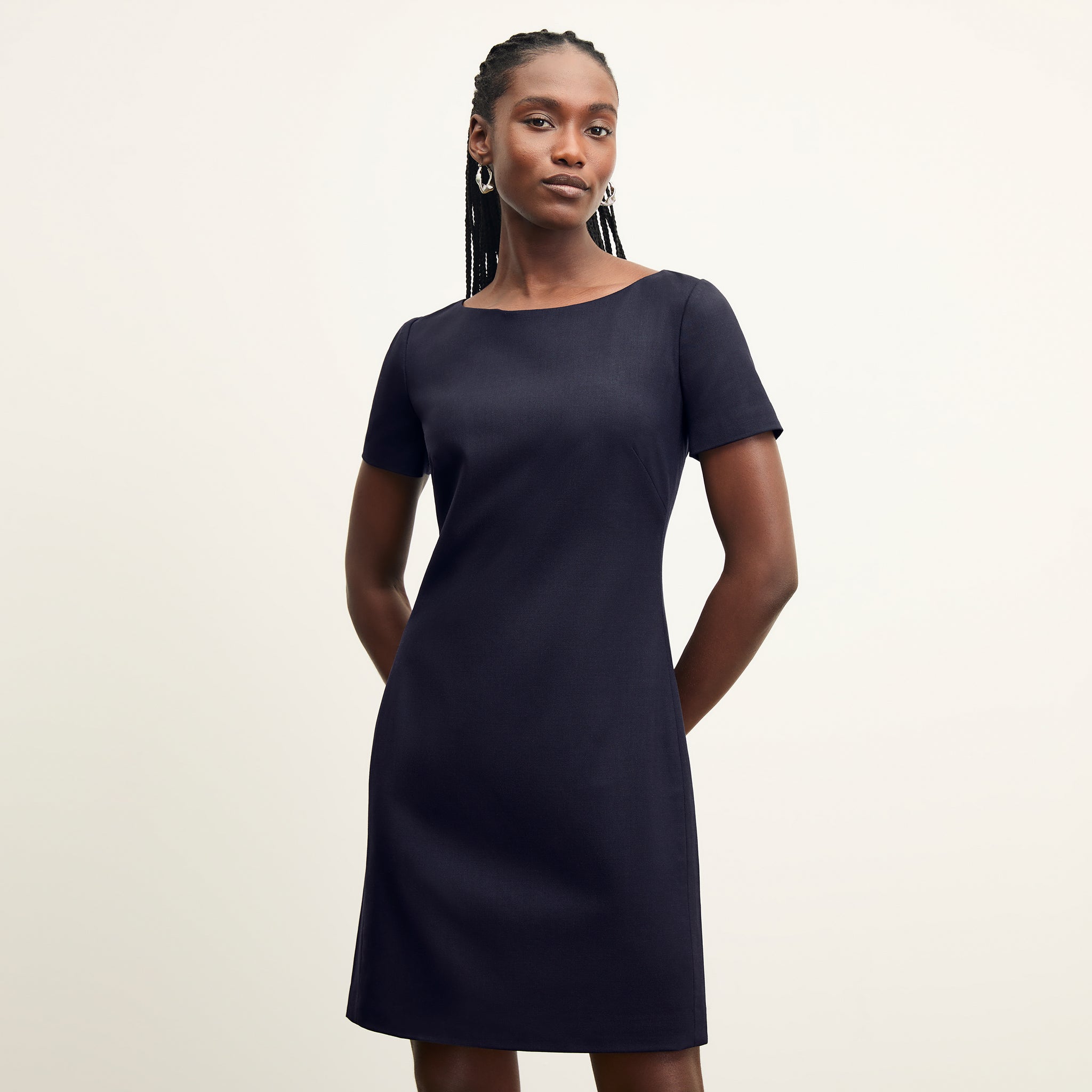 front image of a woman wearing the rosie dress in galaxy blue