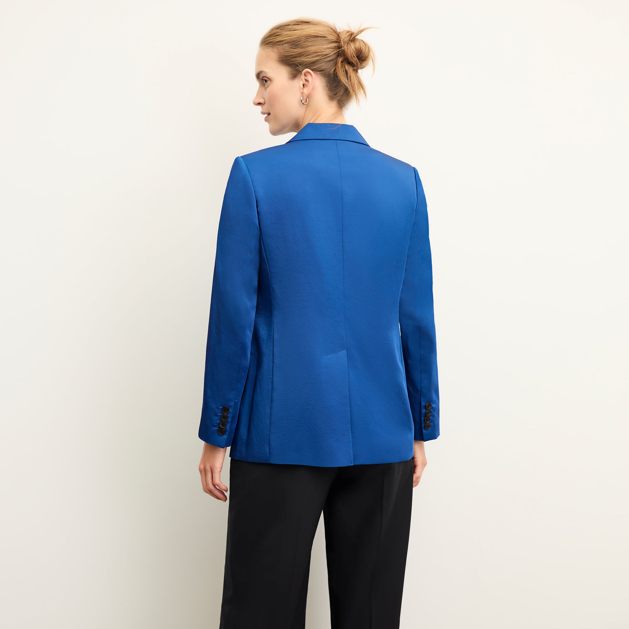 back image of a woman wearing the o'hara jacket in sapphire